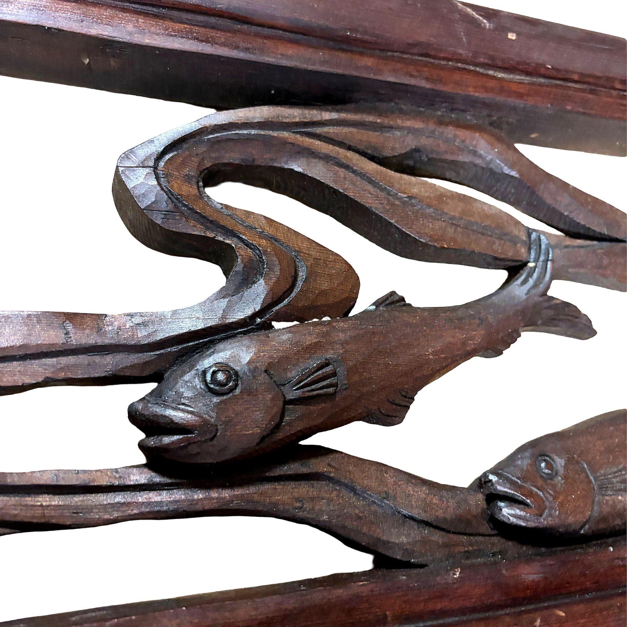 Asian-style Koi fish Wall Sculpture beautifully handcrafted in a red cherry wood carving capturing the fluid motion of Koi fish swimming upstream. Each fish is intricately detailed, showcasing natural wood grain and expert craftsmanship.

Signed 
