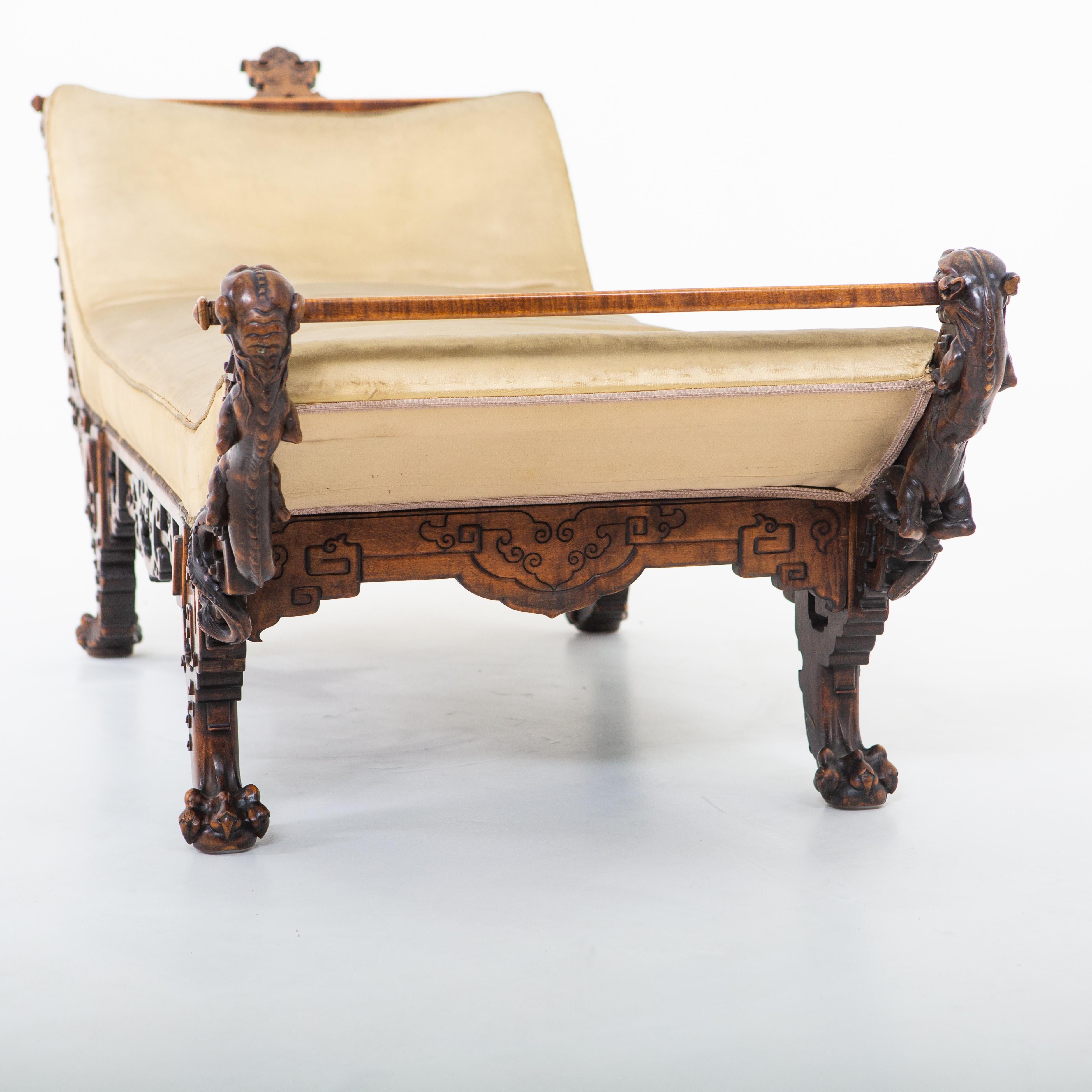 Asian-style chaise-longue or recliner in standing on lion paws. Unrestored original condition.