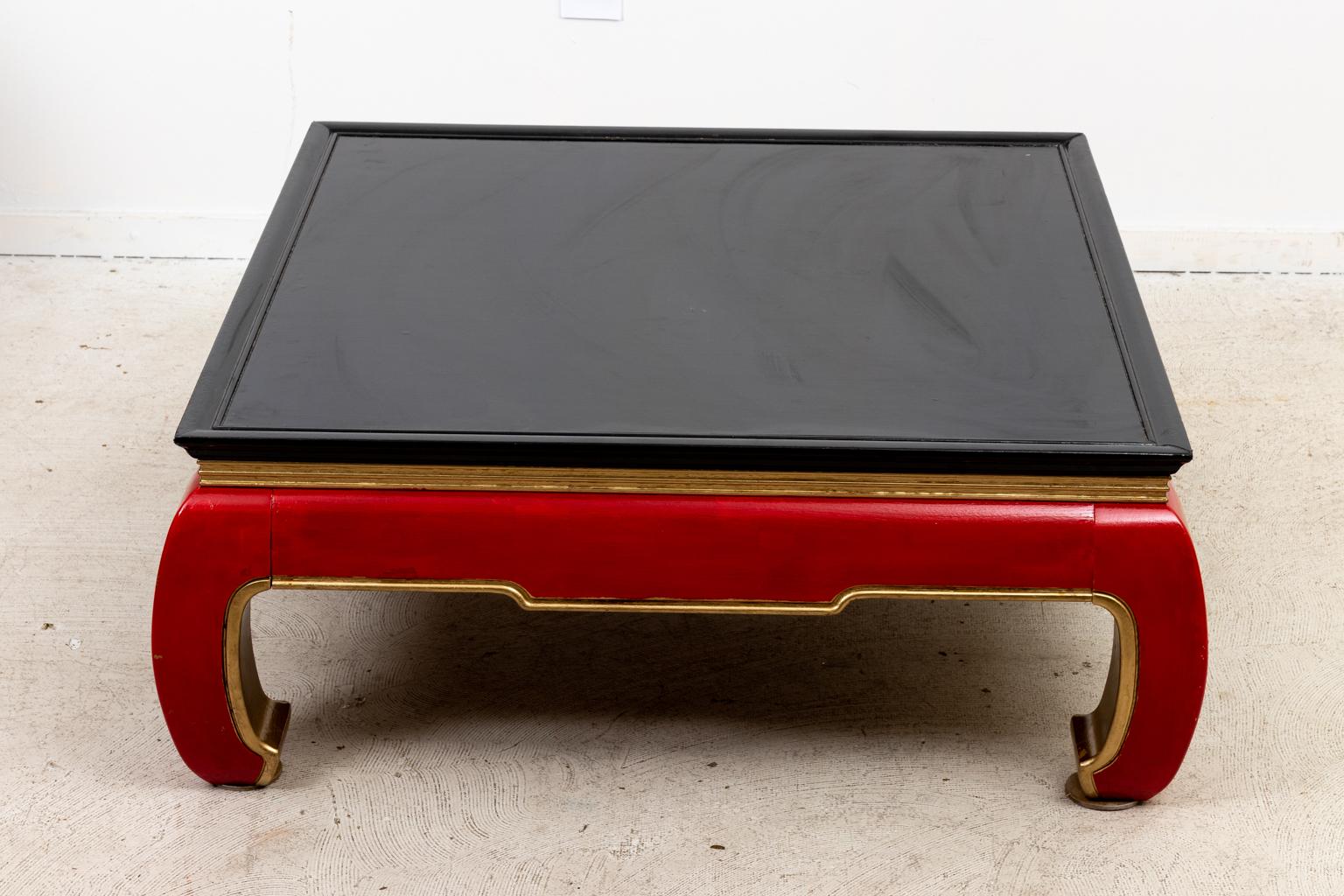 Circa 1960-1980s Asian style square coffee table which has been repainted at some point in black, red, and gold. Please note of wear consistent with age including some wear to painted finish but good overall finish.