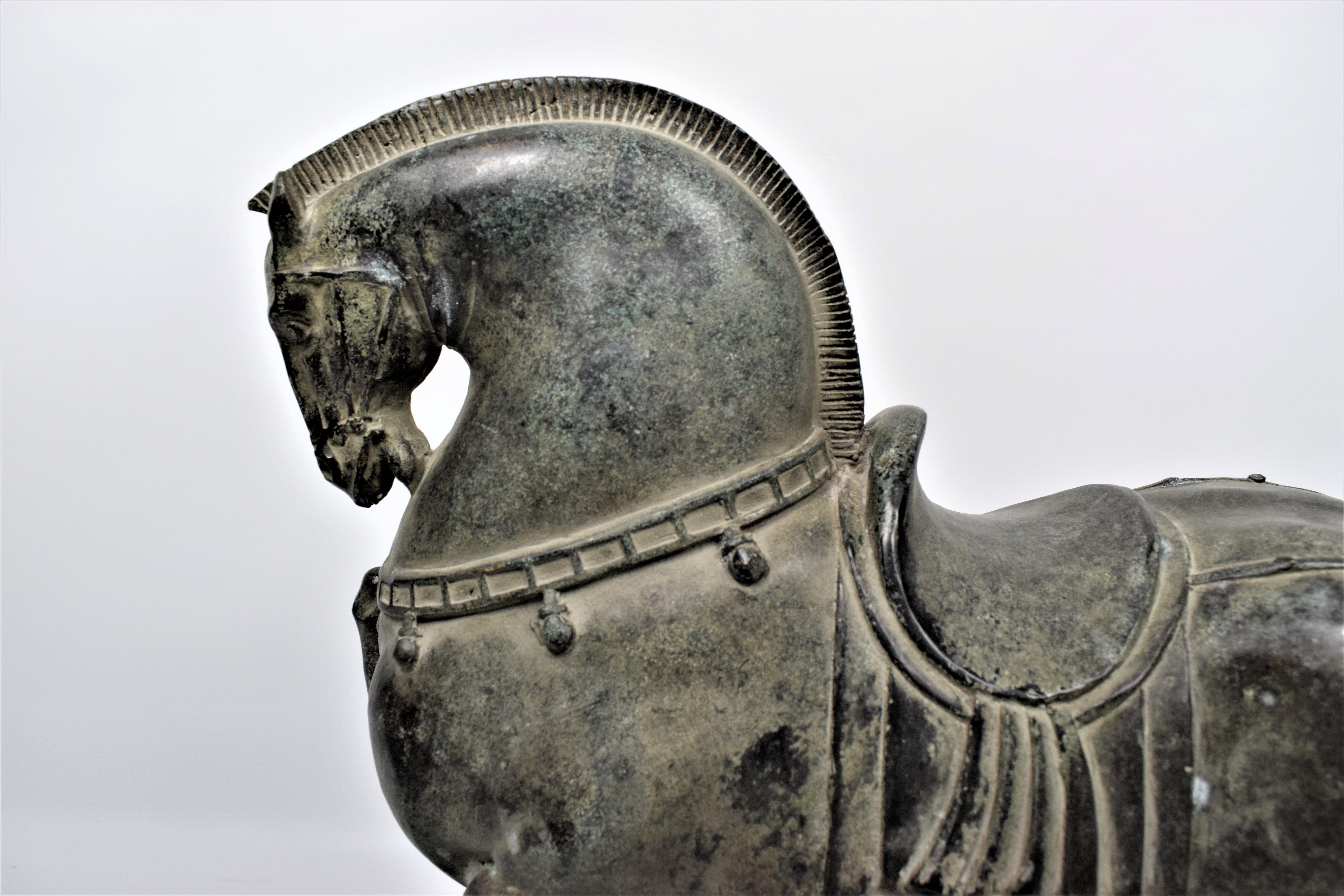 Art Deco Asian Tang dynasty inspired bronze horse

During China's Tang dynasty, horses were loved and revered as symbols of imperial power. The horse itself was a potent image during the vigorous Expansion of the Tang 