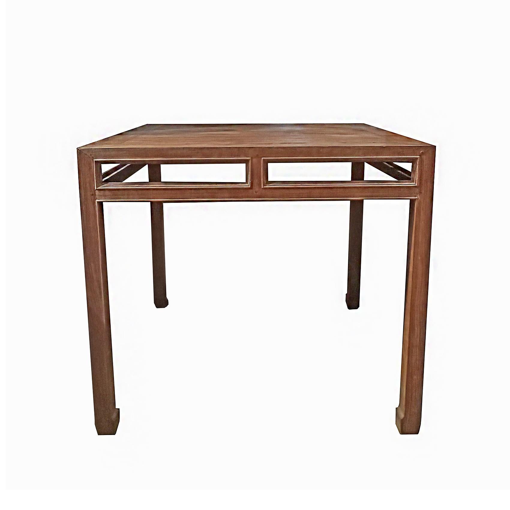 A high-top teak table, hand-crafted in Indonesia, mid-20th Century. 

Clean, straight lines that combine with the traditional Asian design and the simplicity of its turned cornered legs.  At 39 inches high, it's very useful as an outdoor / indoor