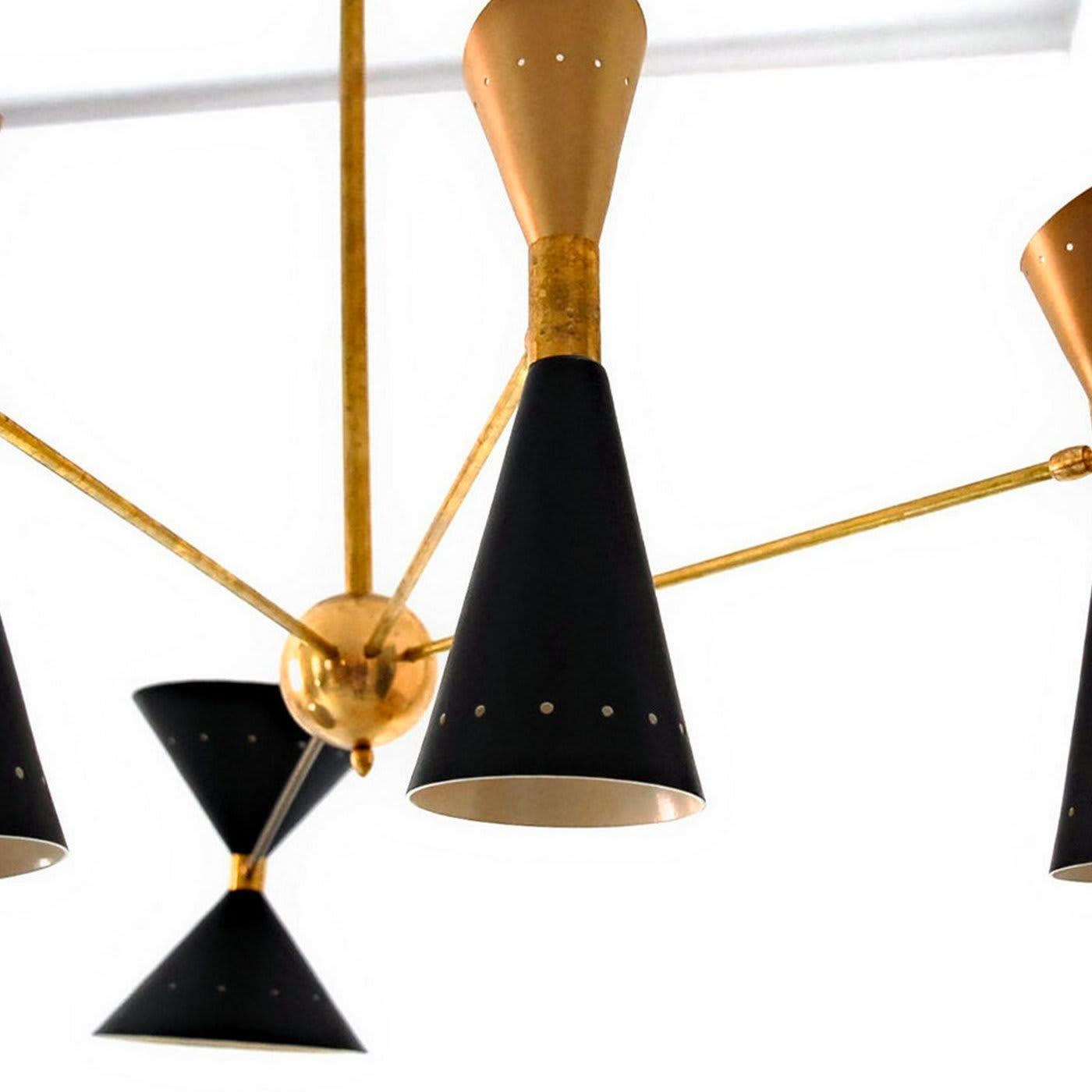 With a stunning design reminiscent of mid-century mobile sculptures, this chandelier features a natural solid brass structure with a central support balancing four arms creating a pleasing asymmetry. Providing a uniform illumination over a dining
