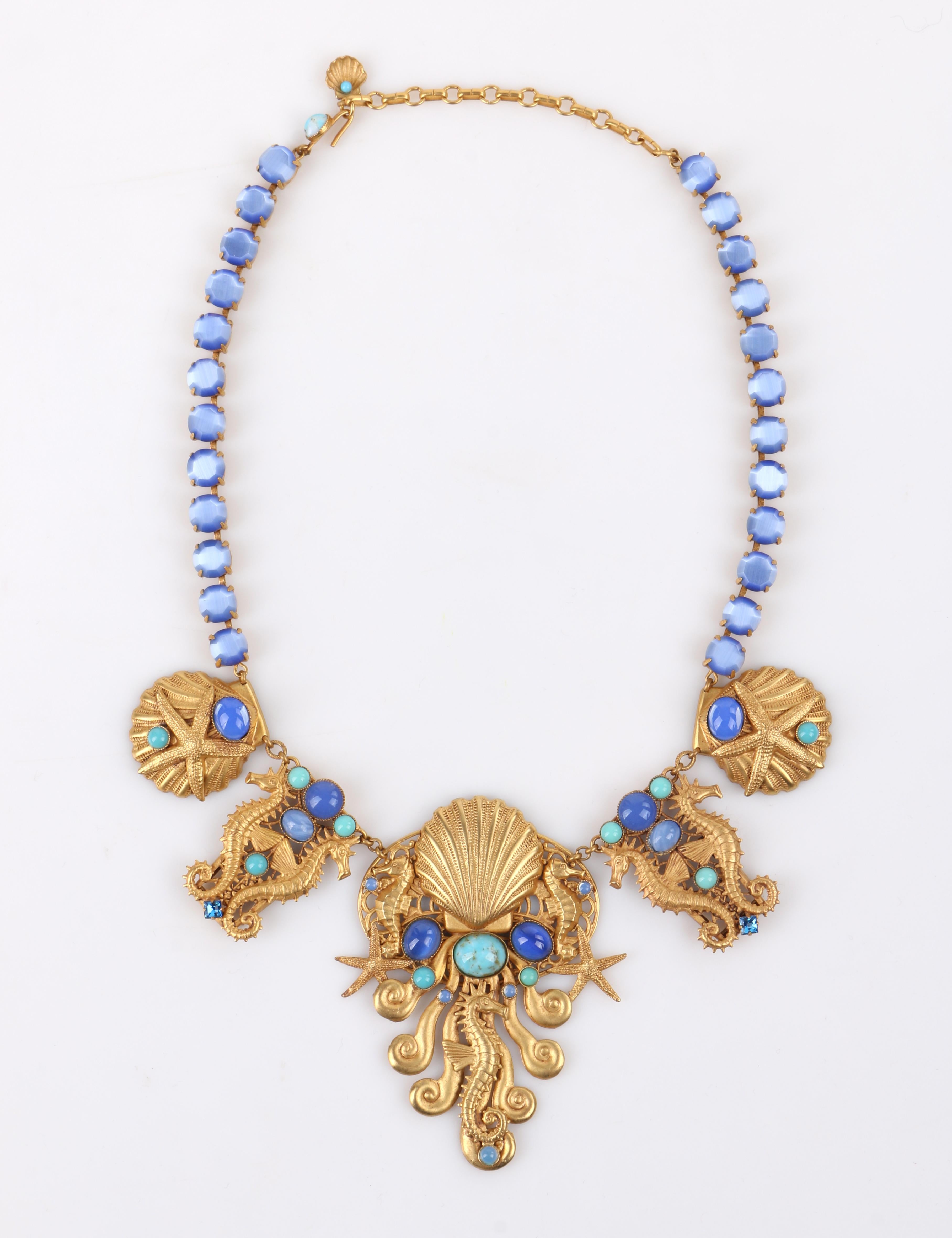 ASKEW LONDON Gold Sea Life Multi-Stone Embellished Bib Necklace Drop Earring Parure Set

Brand / Manufacturer: Askew London
Style: Bib necklace; chandelier earrings
Color(s): Shades of gold (metal); shades of blue and turquoise (stones)
Unmarked