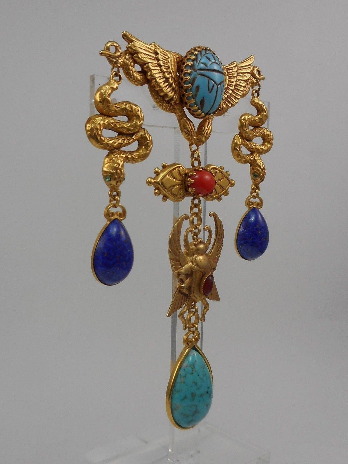 Fabulous Askew London Snake and Winged Scarab Egyptian Revival Drop Brooch; Winged bar set with a Scarab stone, suspending three drops- snakes with Lapis Lazuli Blue glass drops flanking a winged scarab with large Turquoise matrix pear shaped drop;