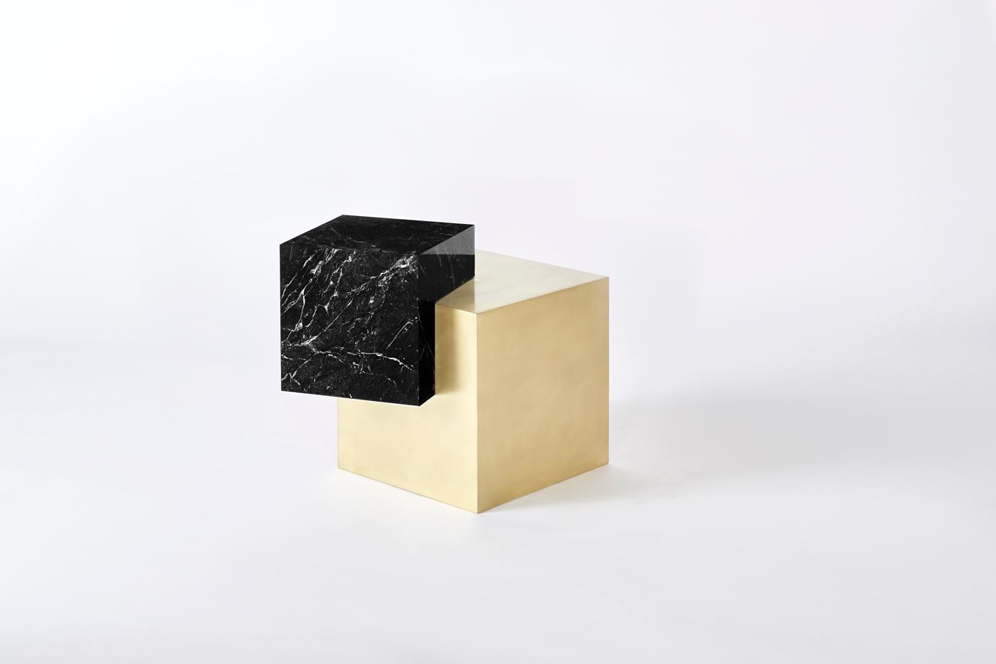 Askew side table - Arielle Lichten 

A brass and marble side table with cantilevering marble cube. 

Measures: 16” W x 20” L x 20” H

Material: White statuary marble brushed brass cube brushed brass cube
 ( different marble colors available