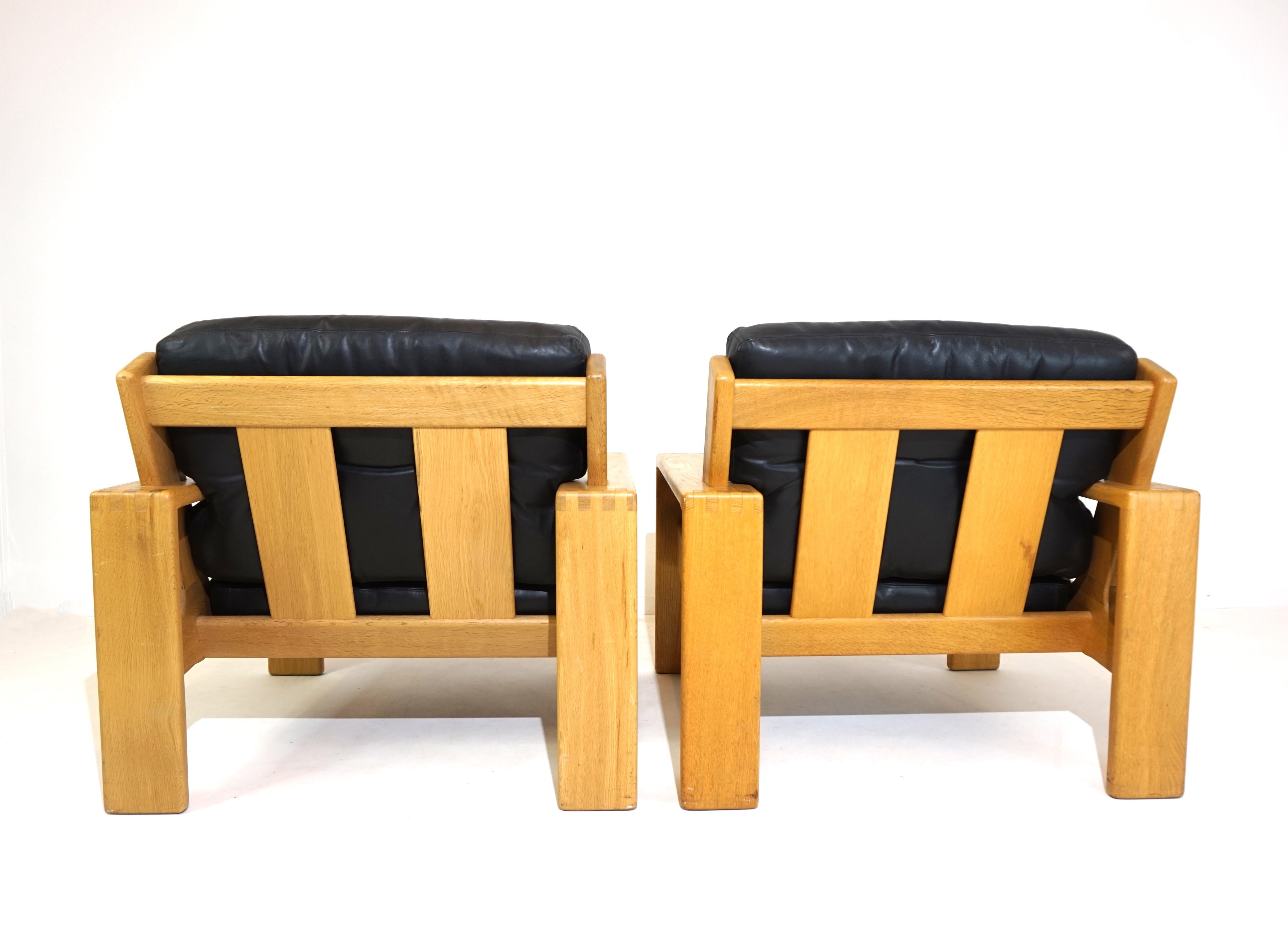 Mid-Century Modern Asko Bonanza set of 2 black leather armchairs from Esko Pajamies For Sale