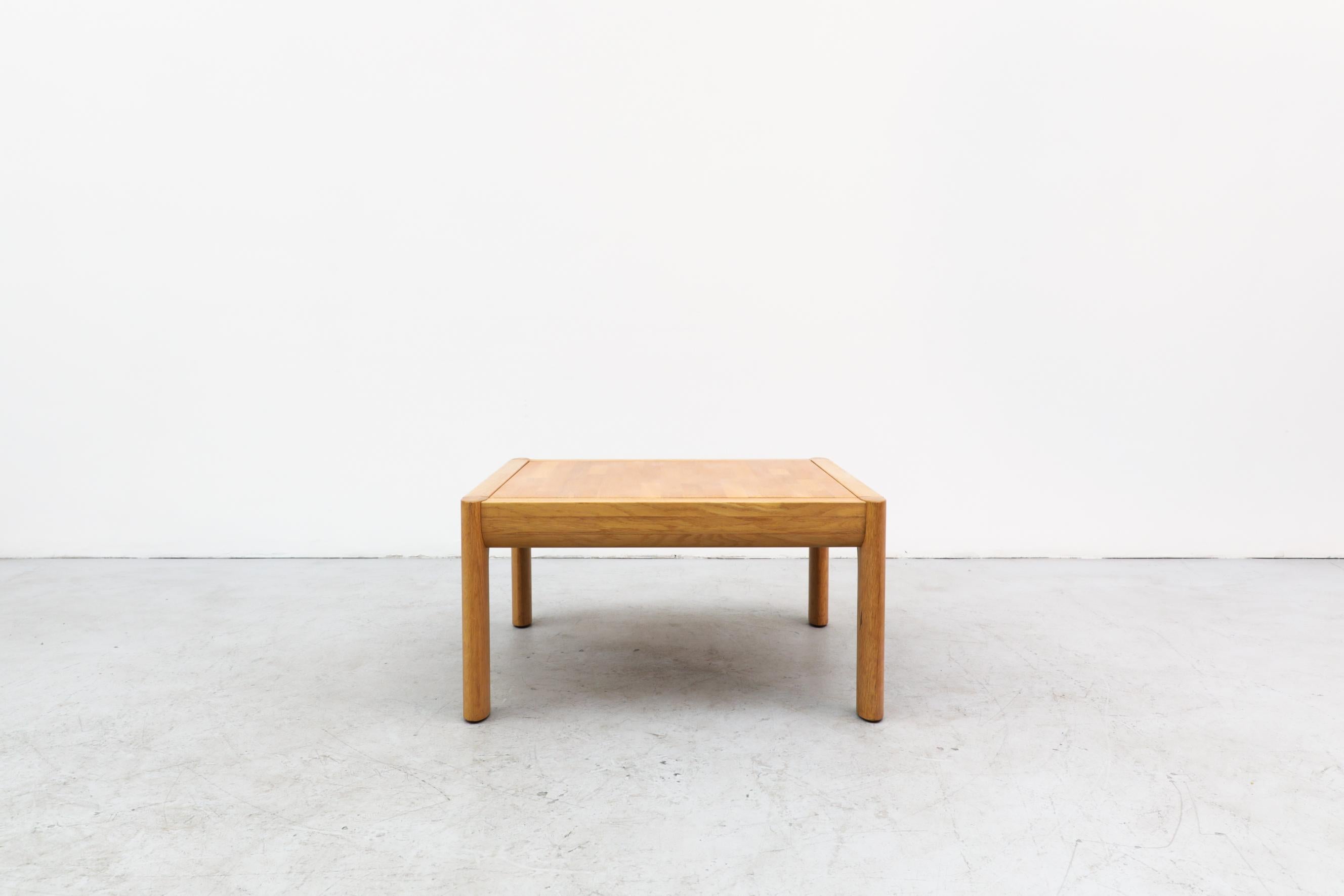 Simple 1970's square oak coffee table with inset top by Finnish design company, Asko. In good original condition with wear consistent with its age and use.