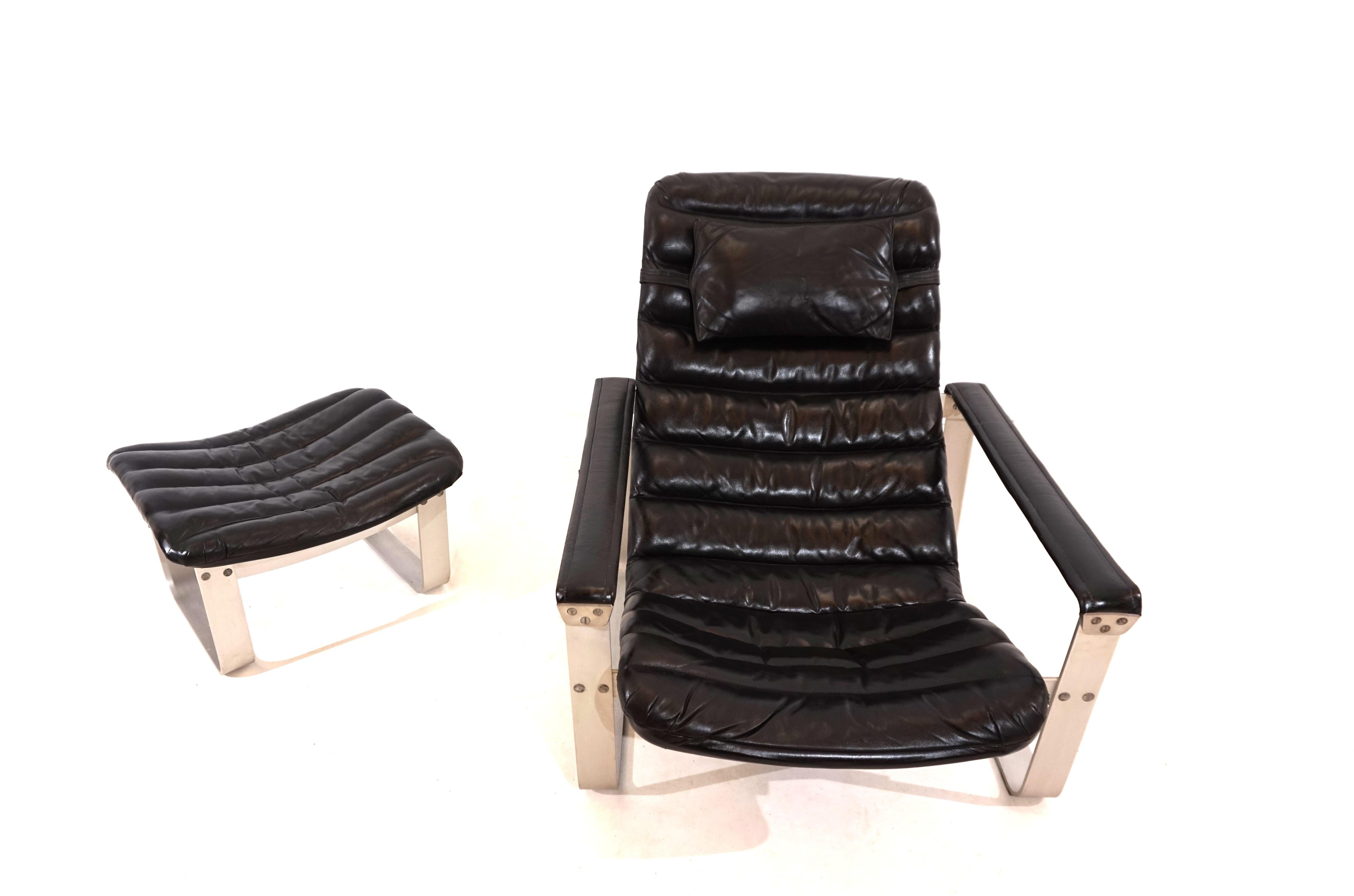 Mid-Century Modern Asko Pulkka leather armchair with ottoman by Ilmari Lappalainen For Sale