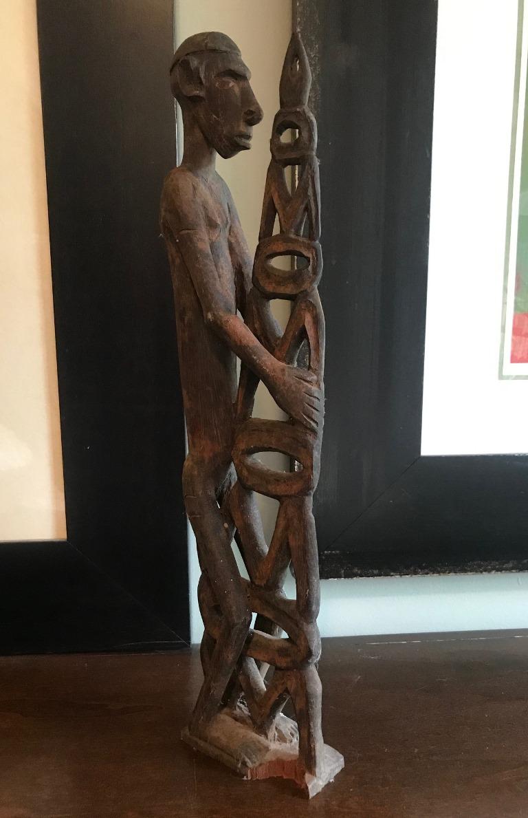 A traditional carved ancestral figure by the Asmat people who are located in the Indonesian province of Irian Jaya in the western half of New Guinea. 

This piece was initially collected in the 1960s and comes from a larger collection of Oceanic