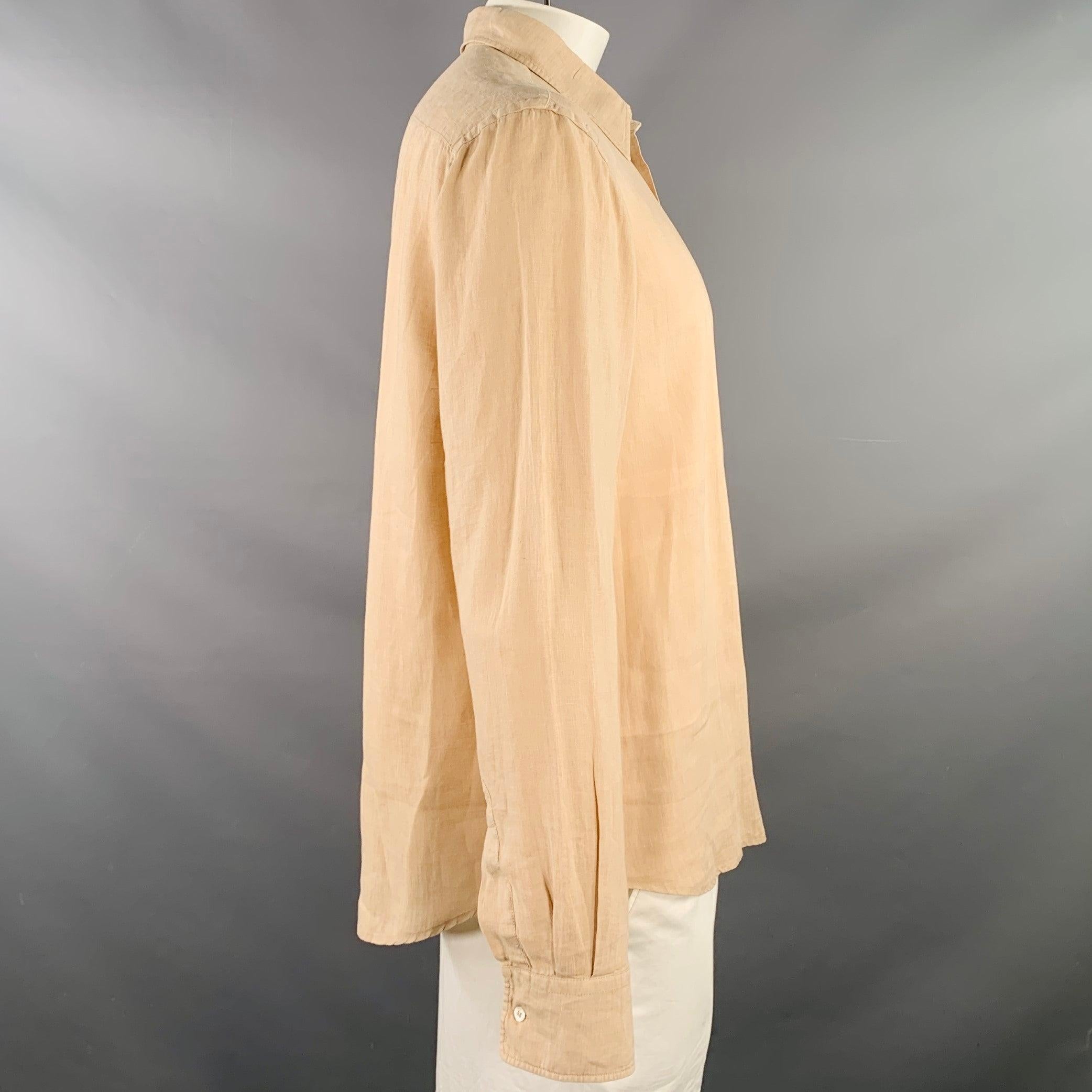 ASPESI long sleeve shirt
in a peach linen woven fabric featuring a pullover style, spread collar, and half placket button closure. Made in Romania.Very Good Pre-Owned Condition. Minor marks on sleeve, and minor pilling. 

Marked:   XL