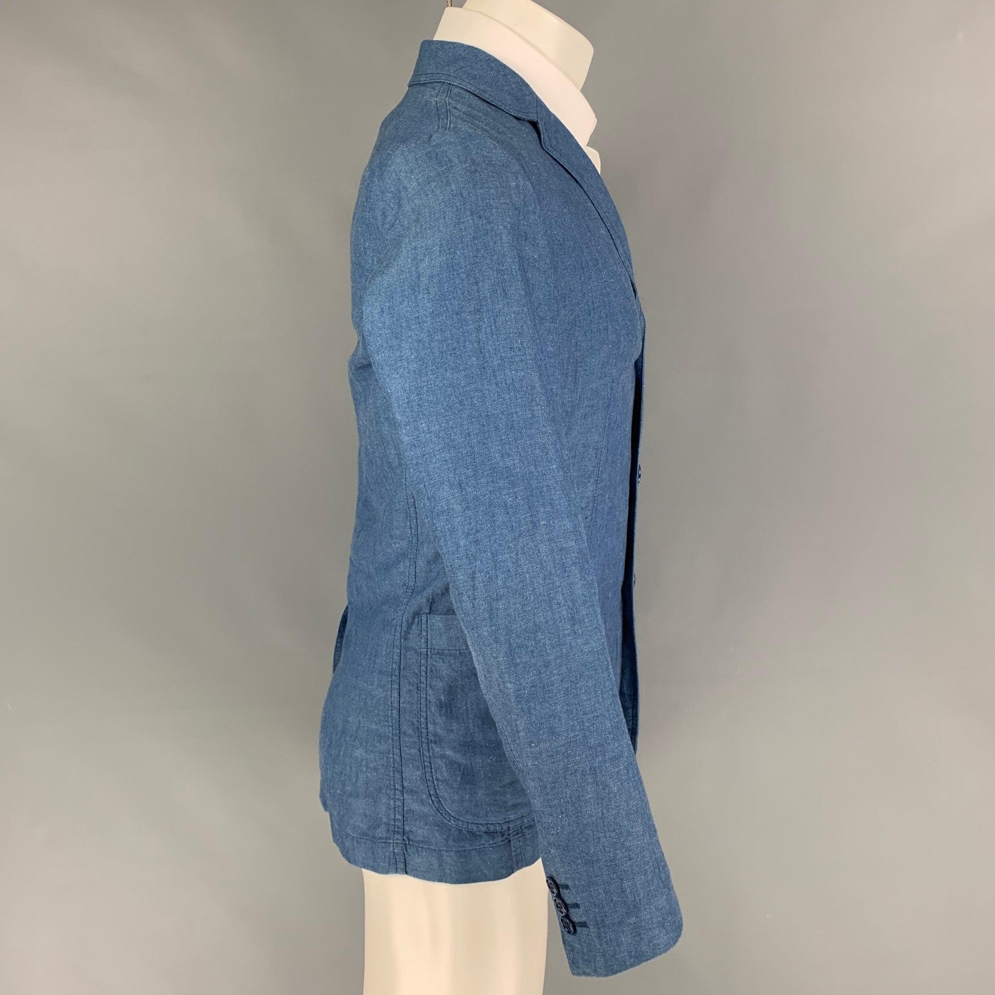 ASPESI sport coat comes in a blue cotton / linen featuring a notch lapel, patch pockets, single back vent, and a three button closure. Made in Italy.
Very Good
Pre-Owned Condition. 

Marked:   XS 

Measurements: 
 
Shoulder: 16.5 inches  Chest: 36