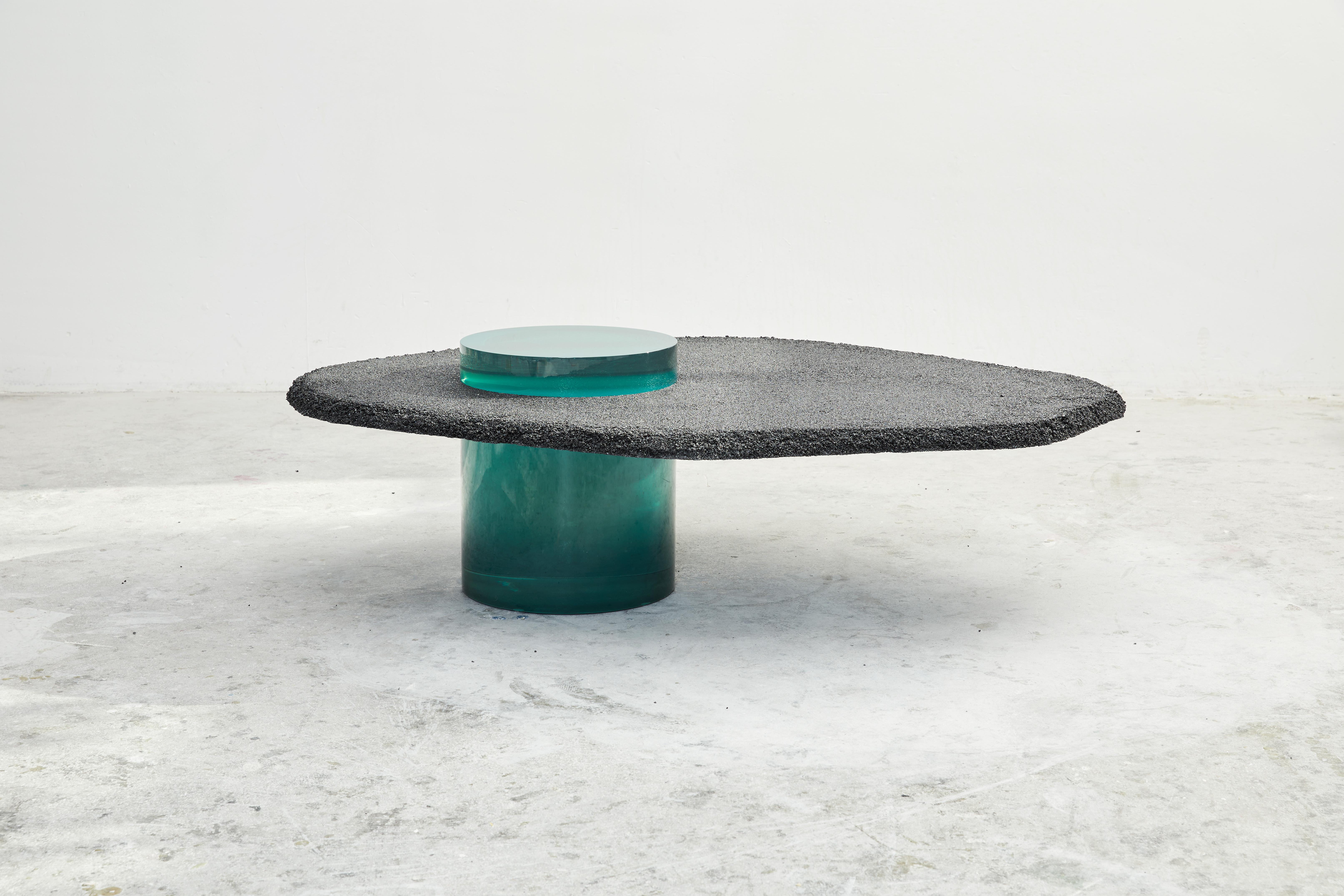 Asphalto coffee table by Cobra Studios
Dimensions: 110 x 140 x 40 cm
Materials: Resin
 Tabletop: natural aggregates mixed with a colored solidifier
 
Solids collection 
The solids collection is a family of dinner tables, coffee tables, side