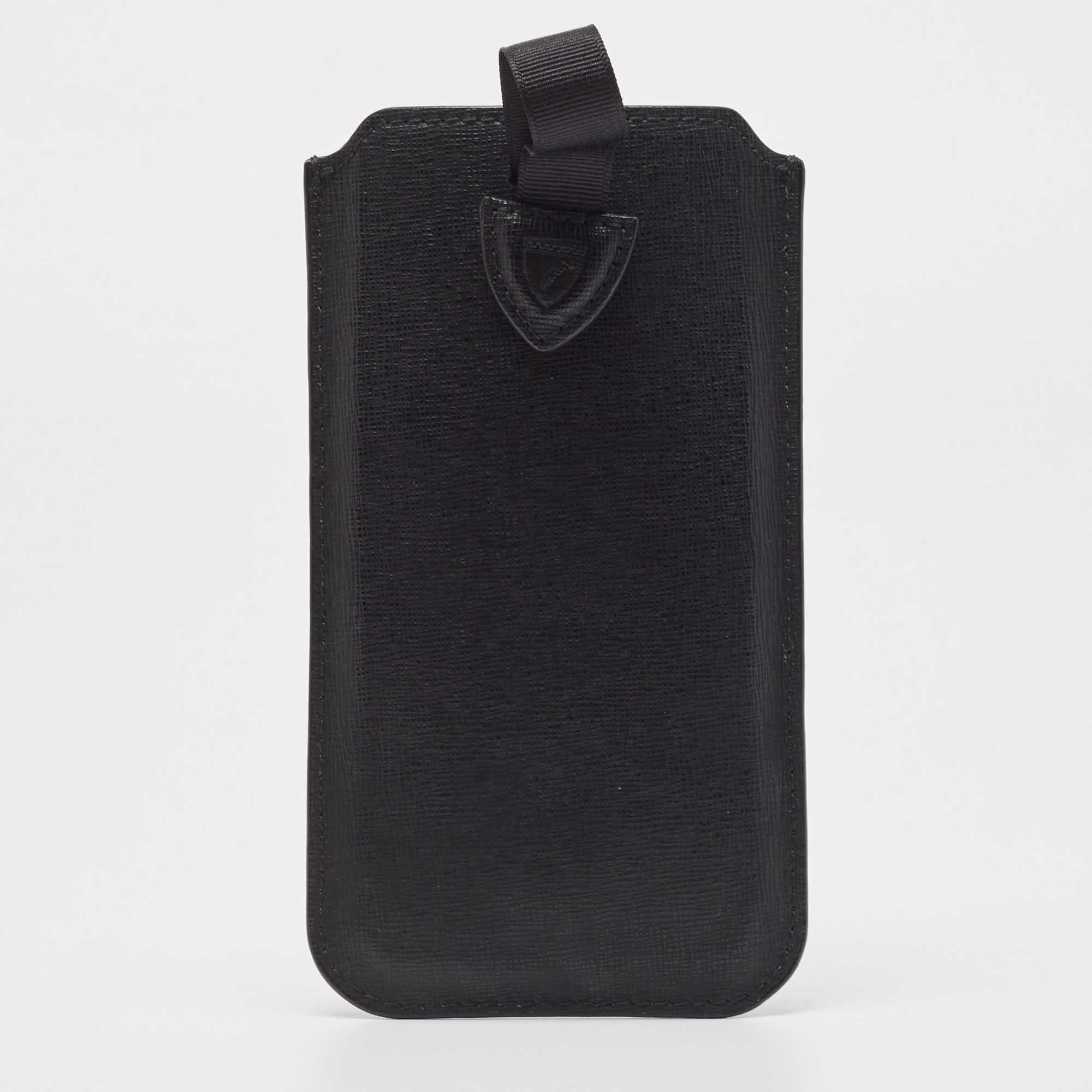 Crafted using leather this phone case by Aspinal Of London is sized to carefully hold your phone. It has a fine finish with the brand name highlighting the front.