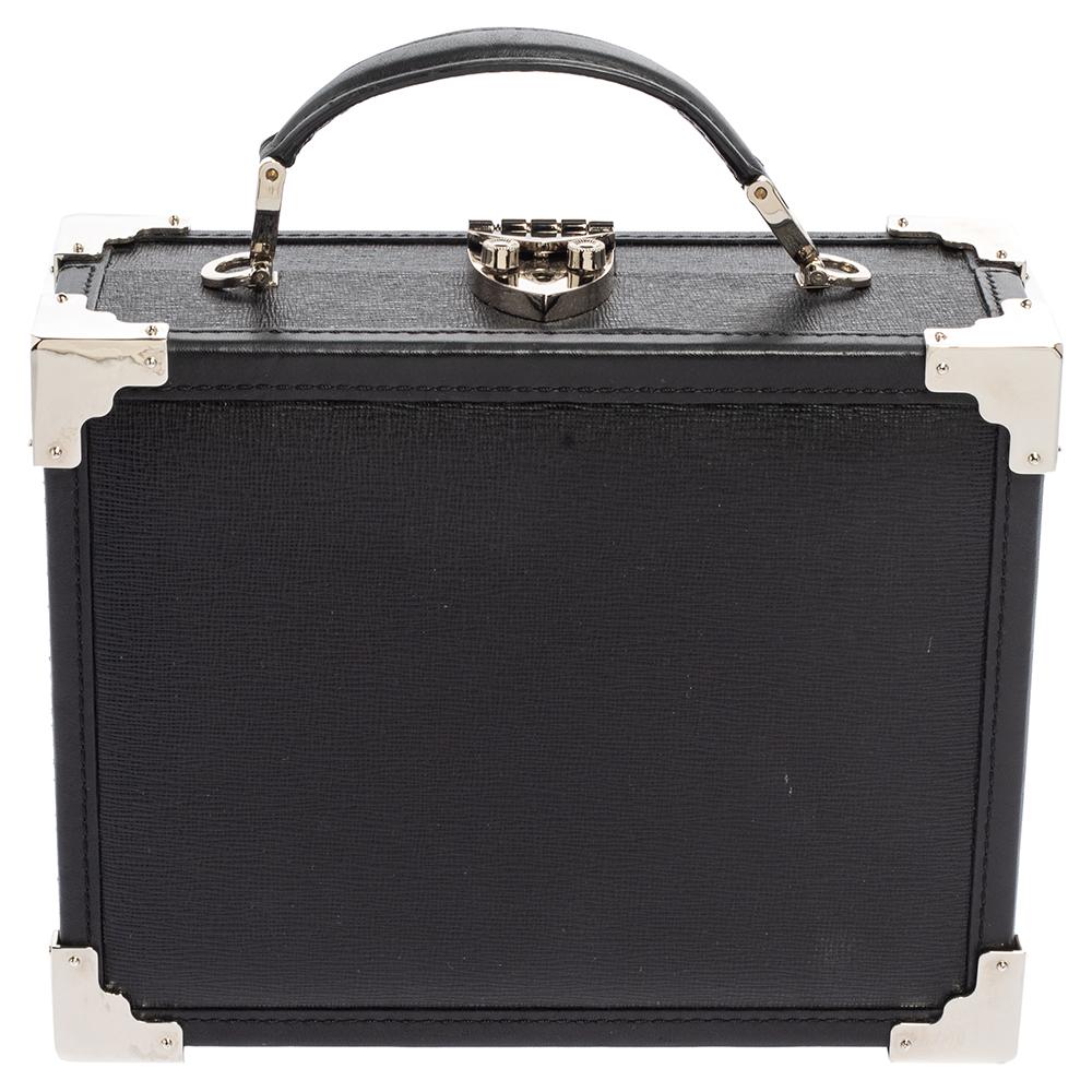 Crafted from leather in a lovely black hue, this Trunk bag is just amazing. Aspinal Of London has designed this luxurious top handle bag with a spacious fabric interior. It has an exquisite design, a detachable shoulder strap, and a silver-tone