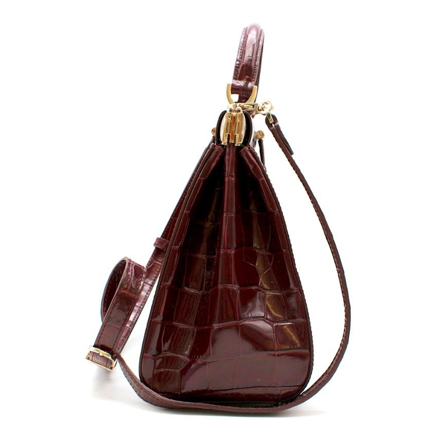 Aspinal of London Small Florence Frame Bag

- Deep shine croc print 
- Structured shape
- Lined in shimmering grosgrain
- Solid brass and aluminium opening mechanism
- Fine Italian signature hardware
- Sturdy flat leather top handle and detachable