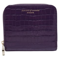 Aspinal of London Portefeuille compact zippé en cuir violet gaufré au crocodile