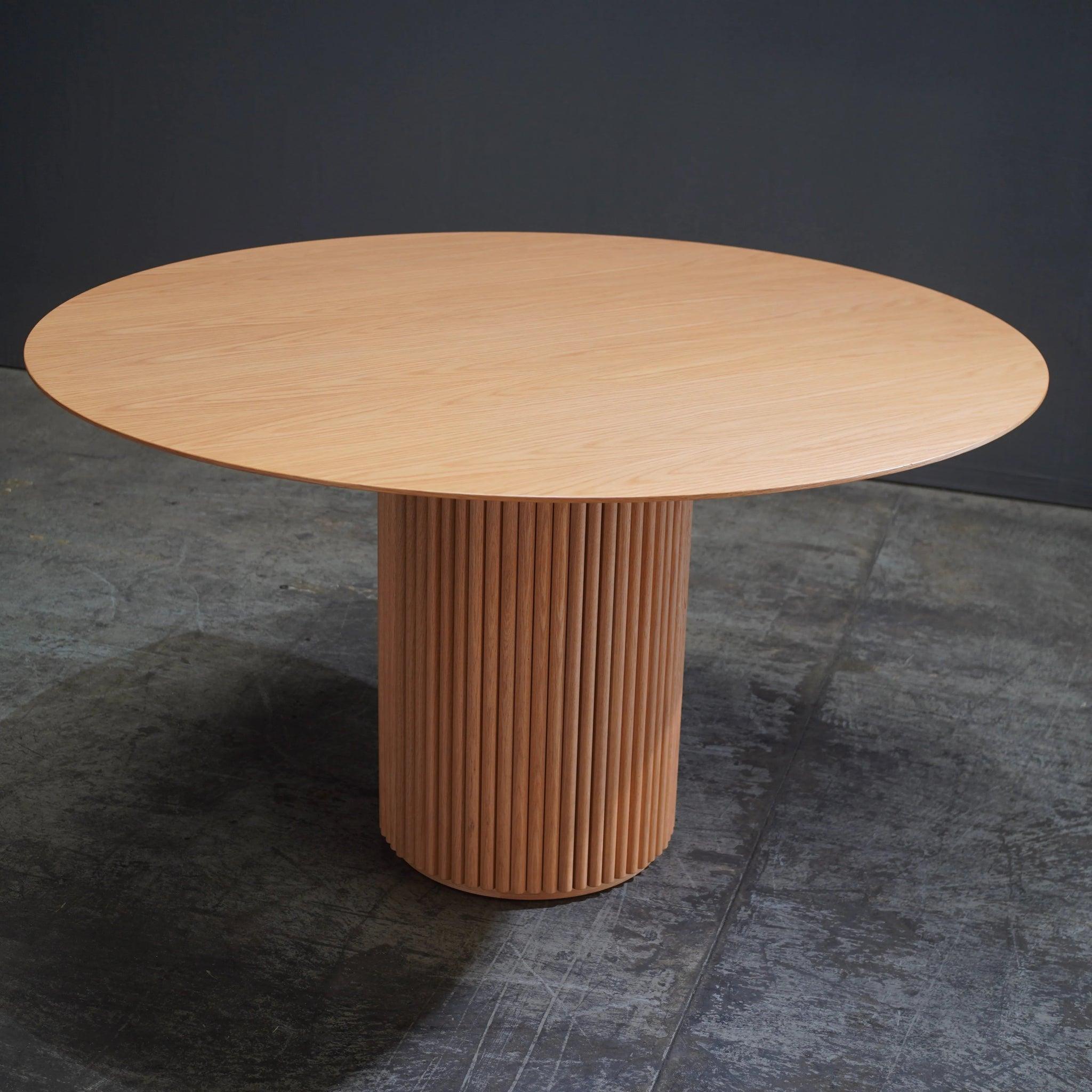 The Asplund Oak Palais Royal Dining Table, crafted by Anya Sebton and Eva Lilja Löwenhielm, is a refined blend of Scandinavian elegance and modern functionality. This stunning piece features a solid oak top that exudes natural beauty, paired with