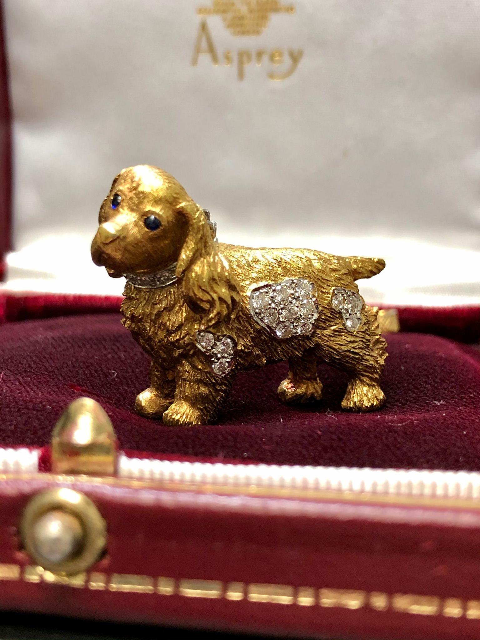 Circa 1970’s, this Asprey of London spaniel pin is so well done. Complete with platinum and diamond lead, sapphire eyes and diamond body, this beautifully made piece has two pin-clasp closures with one being on the spaniel and one on the handle of
