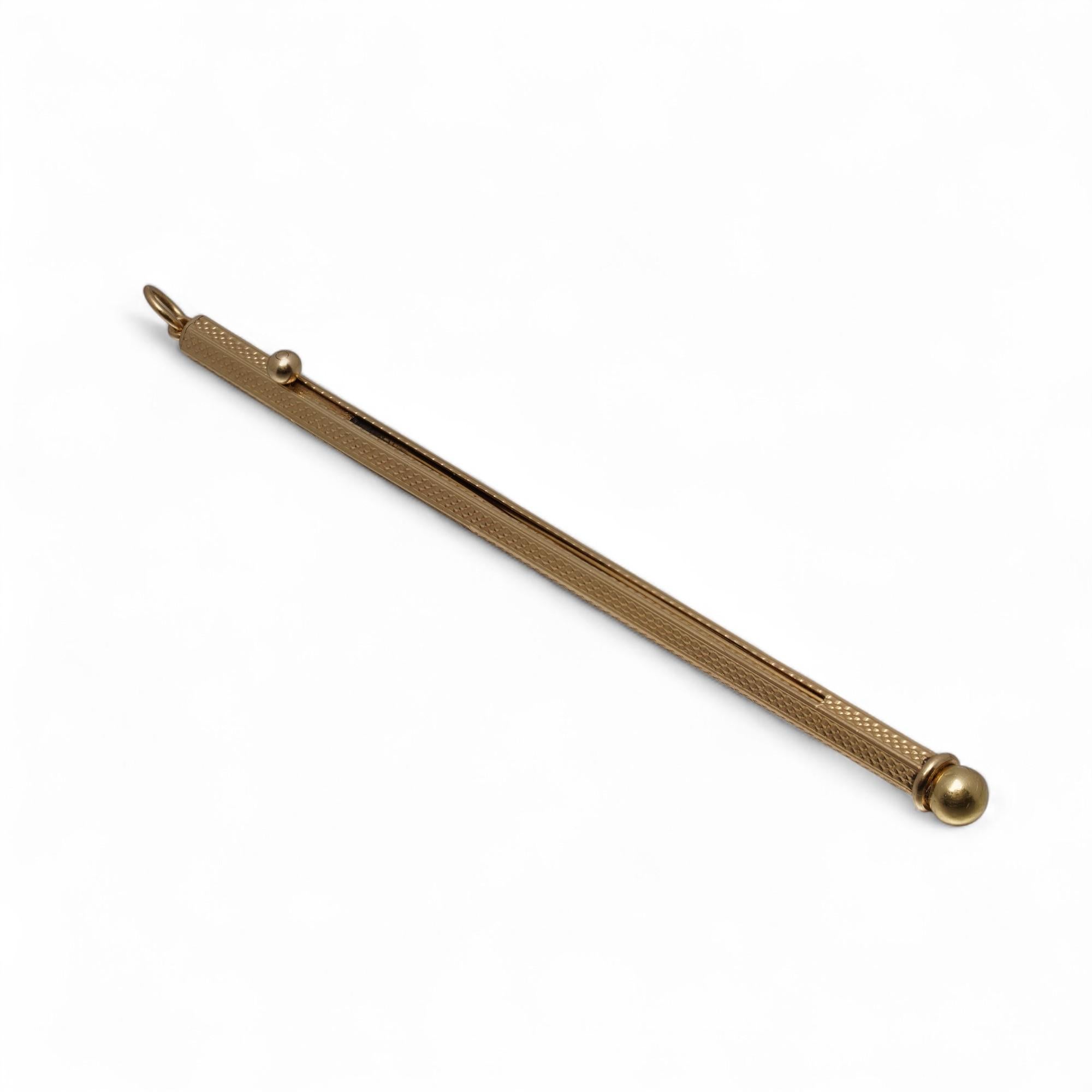 An elegant and collectible telescopic cocktail stirrer crafted in 9 Karat gold, dating to the interwar period. Fully hallmarked for London 1935 and made by the distinguished firm Sampson Mordan & Co., this piece was retailed by Asprey, the iconic