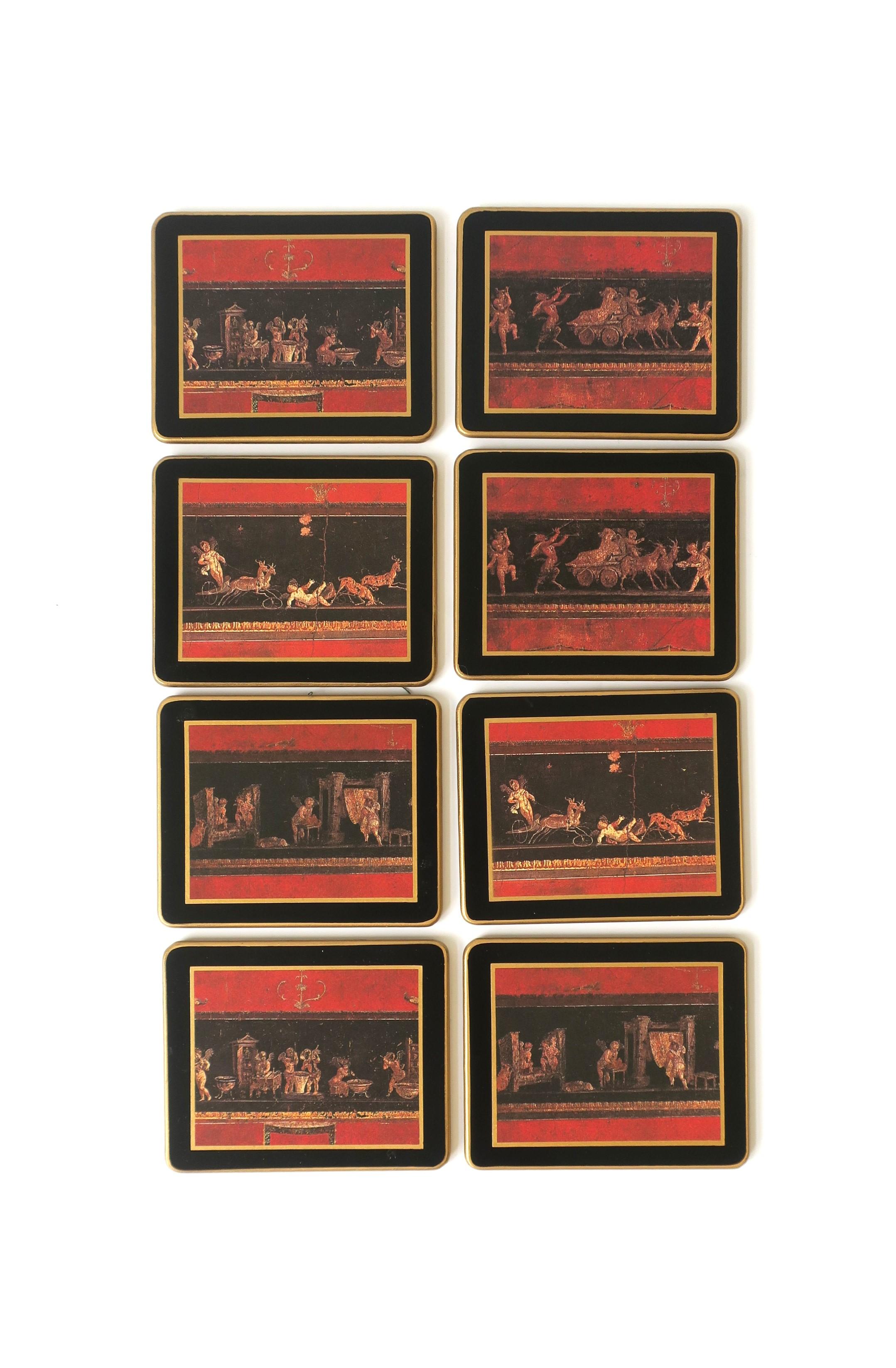 A set of eight (8) black, red, and gold Champagne, wine, cocktails, etc., coasters from English luxury brand Asprey & Company in the Neoclassical-Renisance design style, circa mid to late-20th century, England. A great set for entertaining and a