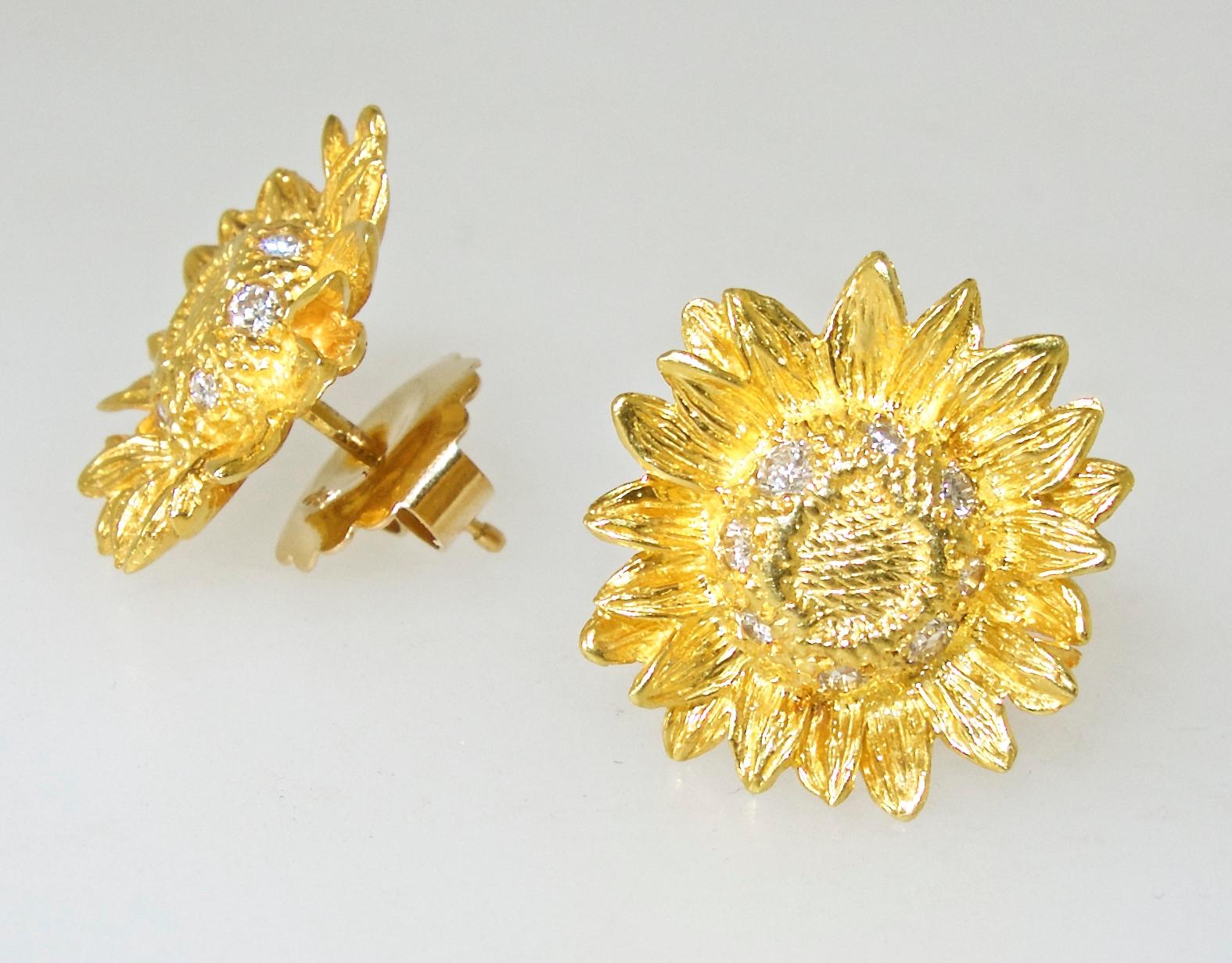 Asprey London sunflower motif earrings set with 16 small white brilliant cut diamonds.   They are .75 inches in diameter and now for a pierced ear, we can also alter them for a non-pierced ear.  Made by the famous London jewelry firm, Asprey & Co.