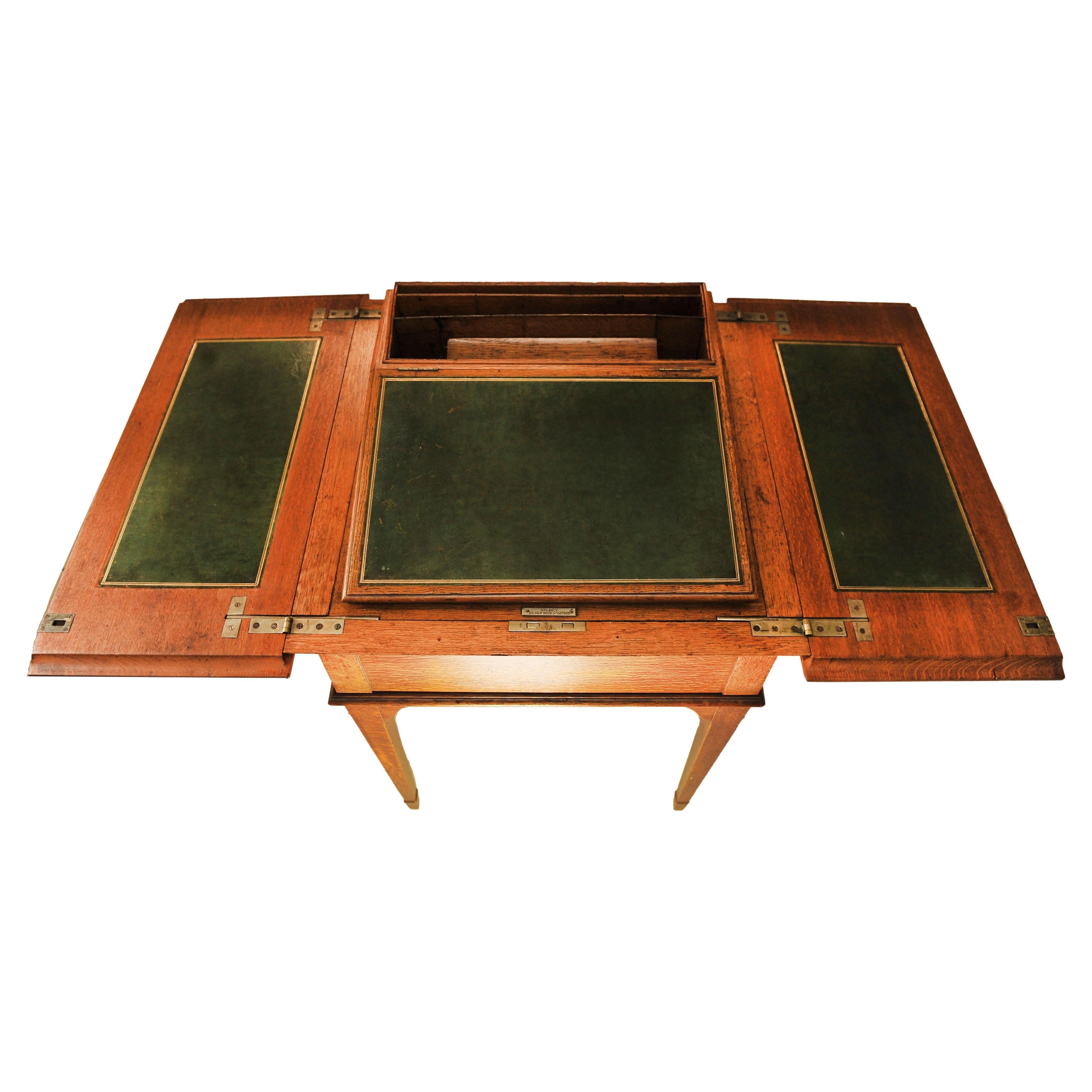 Luxurious, Asprey & Co. London (Royal Warrant) Oak & Tooled Racing Green Leather Pop-Up Writing Table Made in England in the 1920s.

Item is sold complete with a Burgundy tooled red leather desk set also from Aspreys. It's a very attractive item