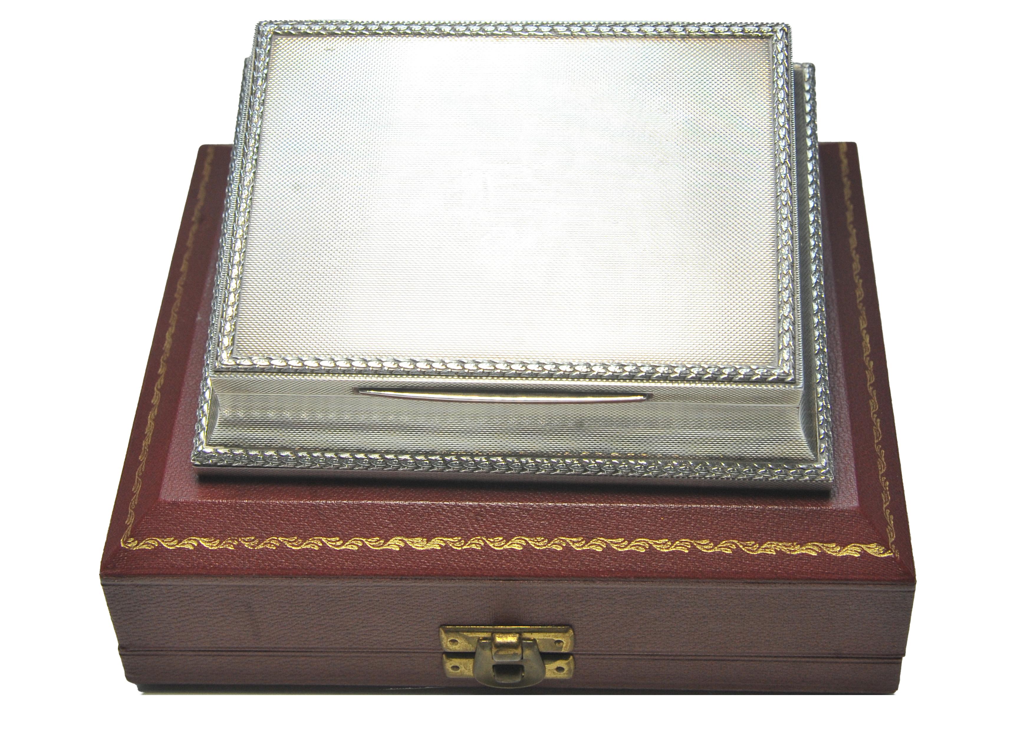 A Sterling Silver Hallmarked Engine Turned Cigarette Presentation Box With A Textured Border, by Asprey & Co London.
Within an original Asprey & Co fitted case.
Weight of silver 475g

Marked 1958

Within the gilt lined hinged lid is an engraving.