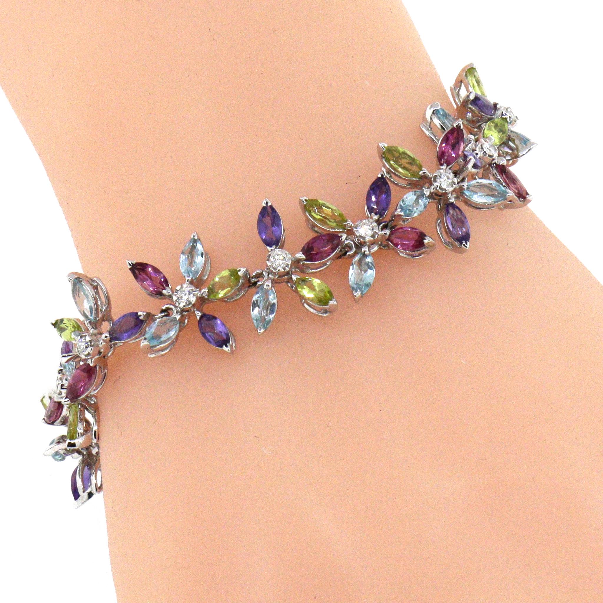 von Asprey Daisy Collection'S
18 kt Weißgold
Steine im Marquise-Schliff
Amethyst, Blautopas, Peridot und Diamant
Länge: 7 Zoll
Preowned - In Asprey Tasche und kommt mit seinen Papieren. 
