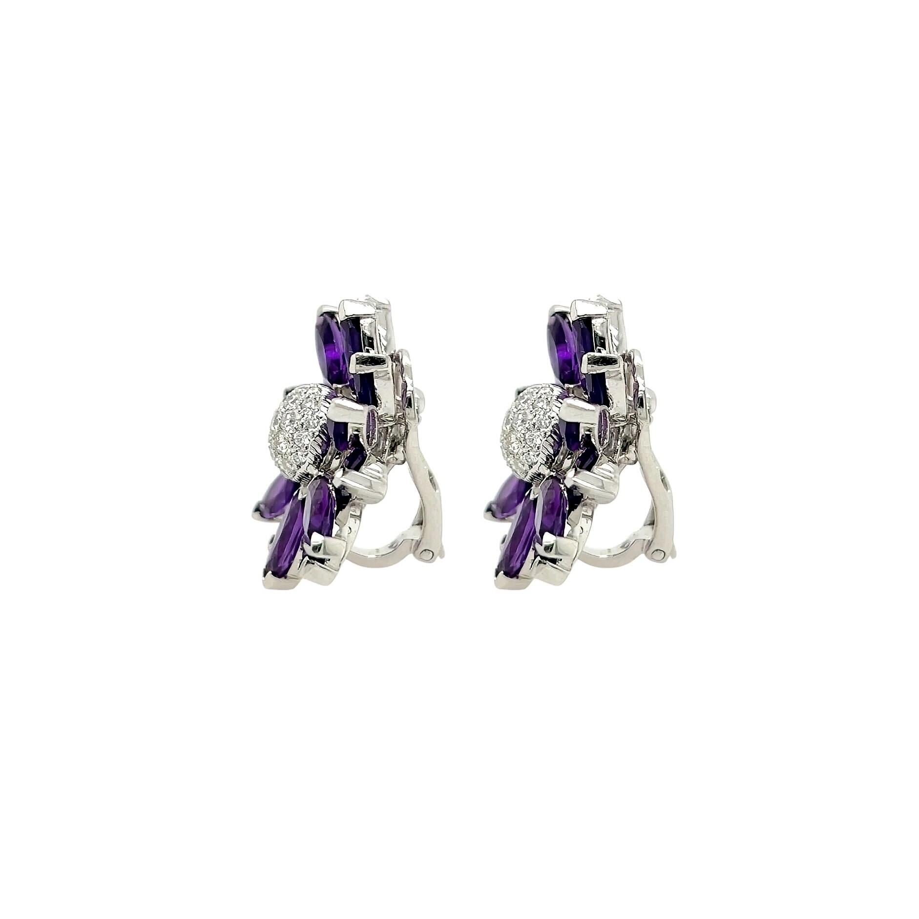 A pair of 18 karat white gold, amethyst and diamond earrings, Asprey.  Each Daisy earring in the medium size designed as a flower, the 14 petals formed by 14 marquise cut amethysts centering a dome pave set with approximately 22 round brilliant cut