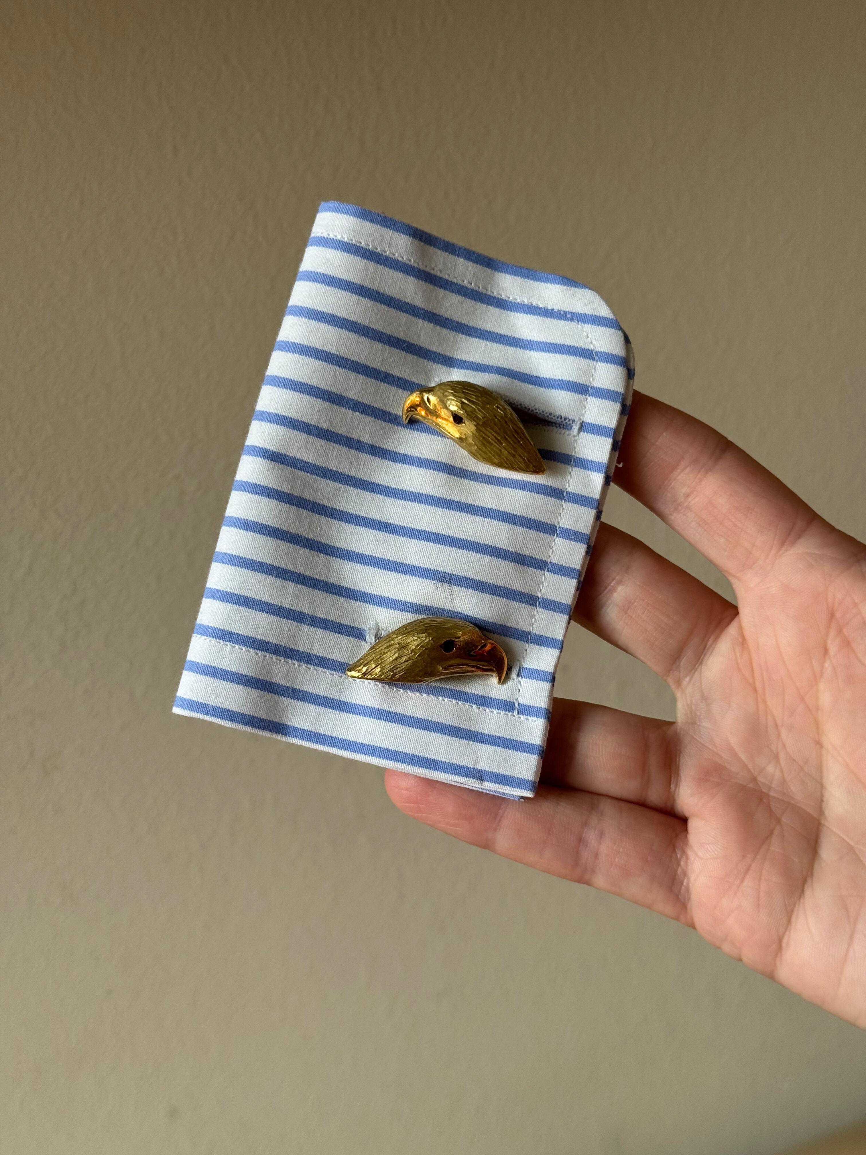 Pair of 18k yellow gold eagle head cufflinks by Asprey of London for Deakin & Francis, with ruby eyes.
Cufflink top (head) measures 32mm x 14mm. 
Weight - 31.2 grams.
Marked on the hardware: Asprey, 750, Gold English marks, D & F.