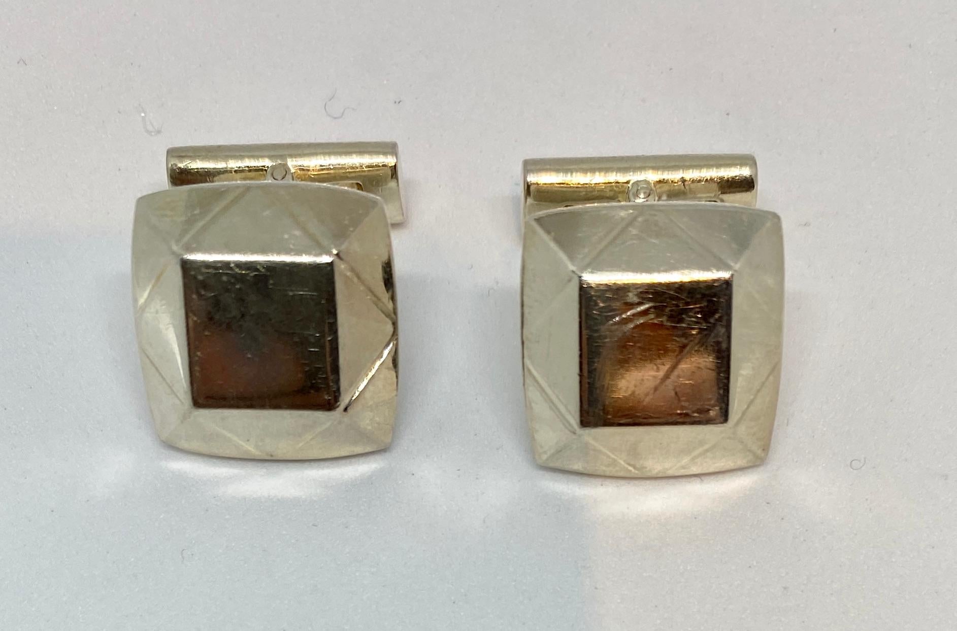 A rare pair of cufflinks in a geometric design by Asprey London.

The cufflink faces measure 16.7mm square and bear hallmarks for the London Assay Office, the year 2002 and 925 indicating solid sterling silver. They feature toggle backs and together