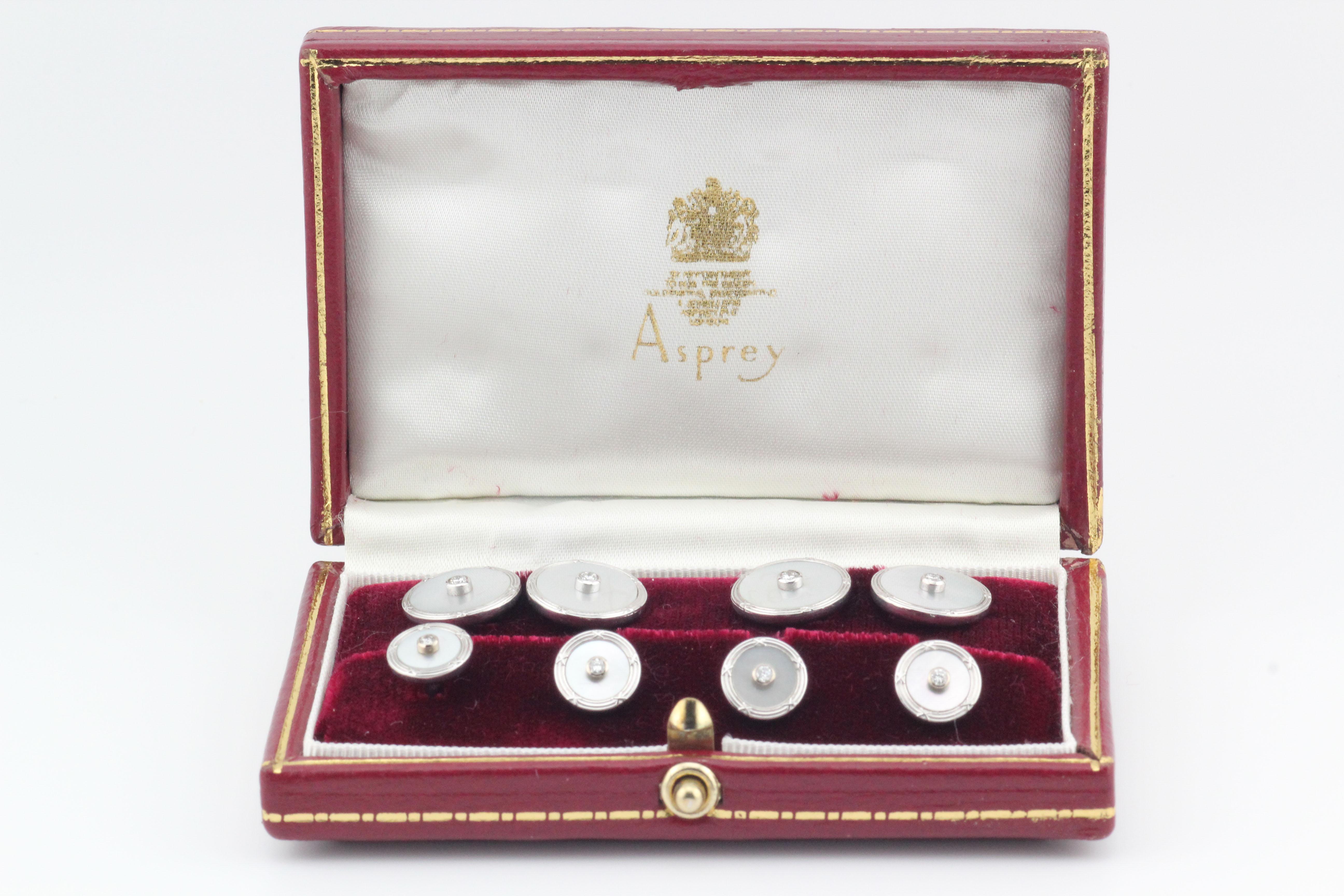 Fine set of Mother of pearl diamond and 18k white gold cufflinks and studs tuxedo set, by Asprey circa 1990s.   

This Asprey set is a luxurious and sophisticated accessory collection designed for formal occasions. Asprey, known for its exquisite