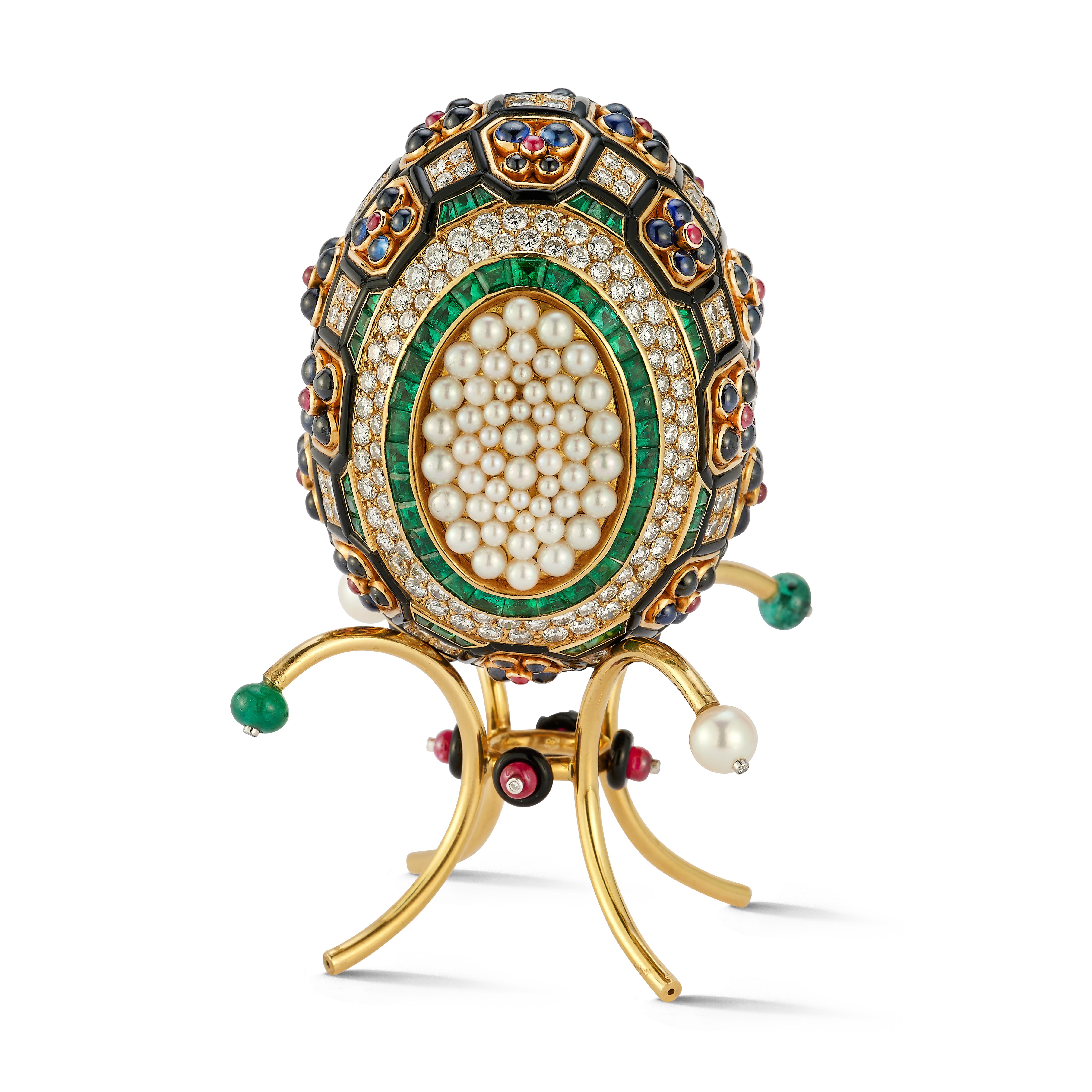 Asprey Jeweled Egg

An incredible multi gem desk object set with diamonds, rubies, emeralds, sapphires, onyx and pearls. Includes a stand made with 18K Gold. 

Signed: Asprey

Egg Measures at approximately 2.5
