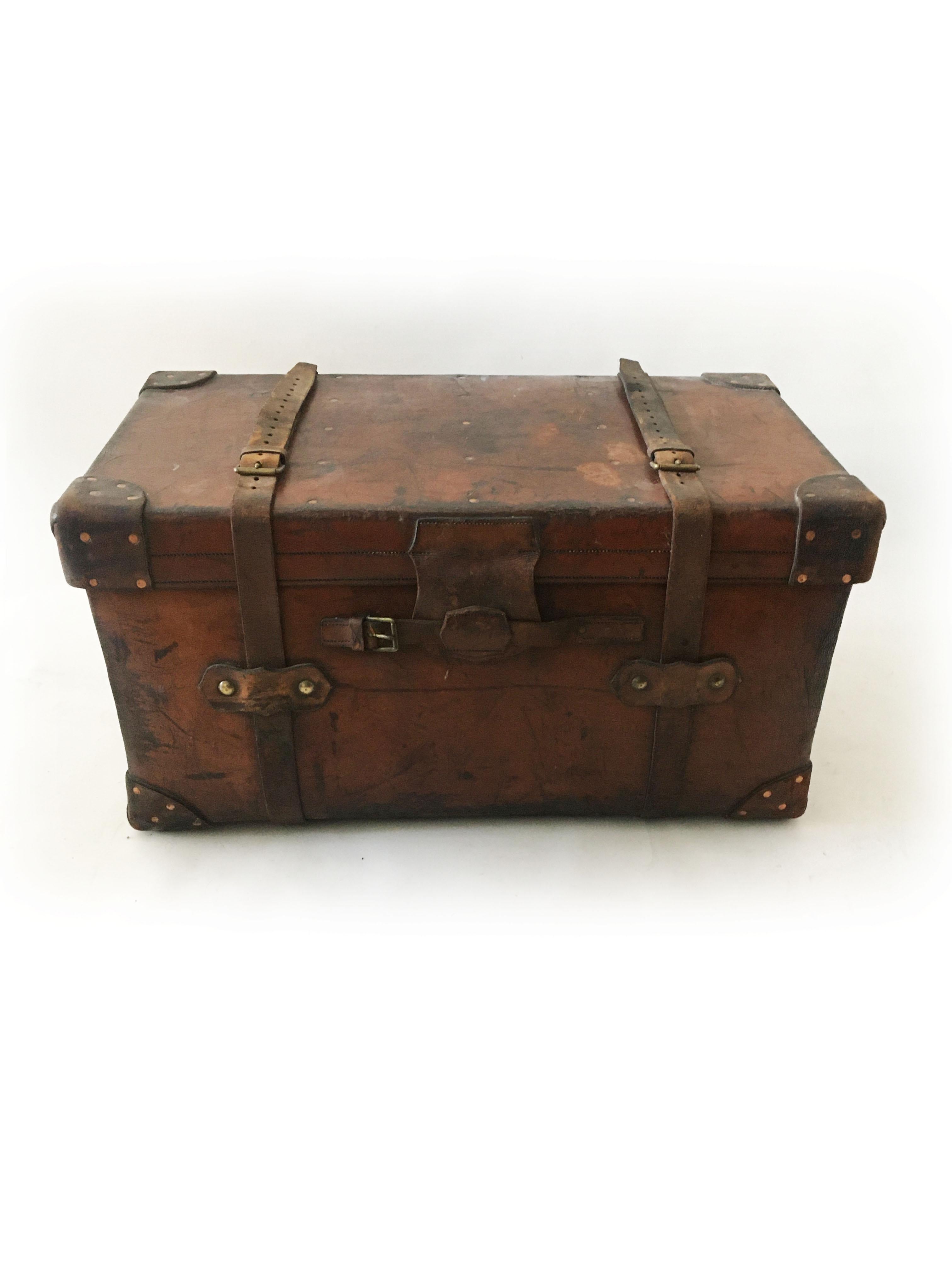 A tremendous 1900s leather trunk by Asprey London, with initials T.B. From its central London location, Asprey advertised 'articles of exclusive design and high quality, whether for personal adornment or personal accompaniment and to endow with