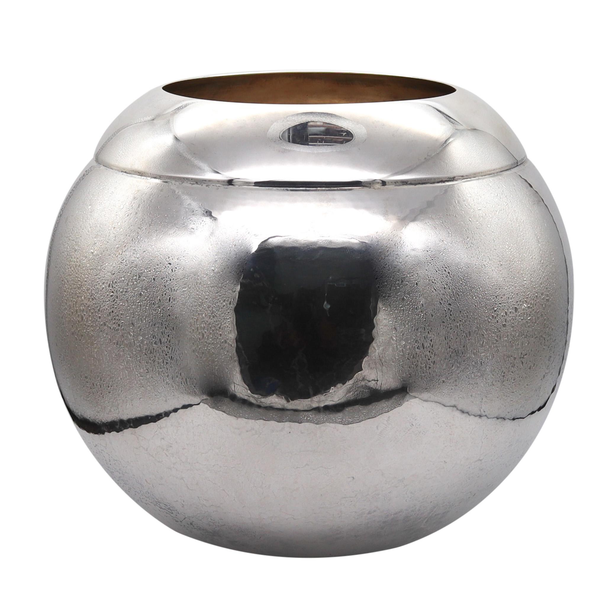 Silver vase designed by Asprey of London.

A gorgeous oversize spherical decorative vase, created in London England by Asprey. It was crafted with modernist patterns in very fine solid .925/.999 sterling silver and decorated with hammered and high