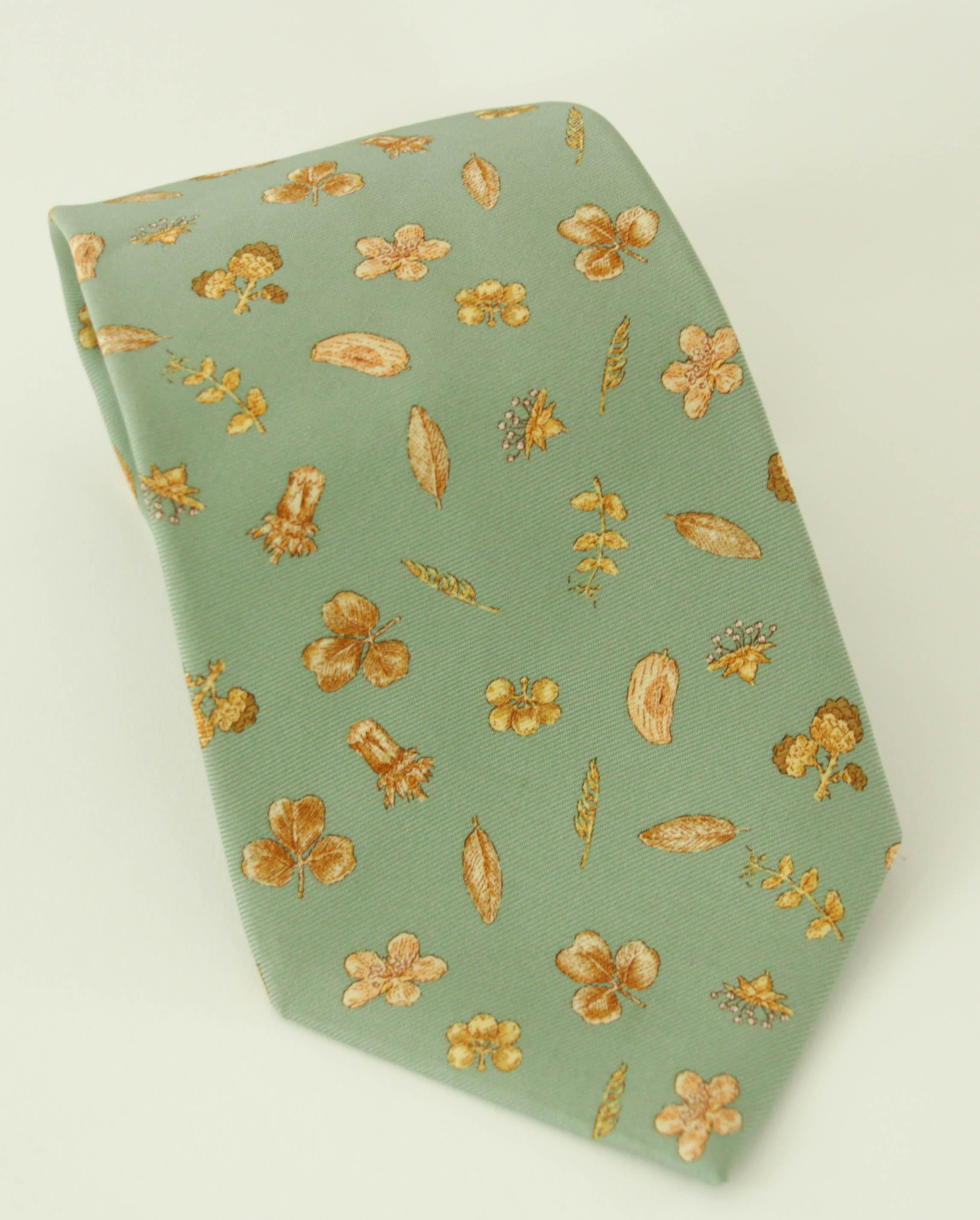 Asprey London teal green silk tie with light tan brown foliage print silk tie men dress necktie.
Asprey London tie, light teal green design printed silk hand made in England.
Asprey London luxury silk necktie. 
Made in England.
100% silk Dry clean