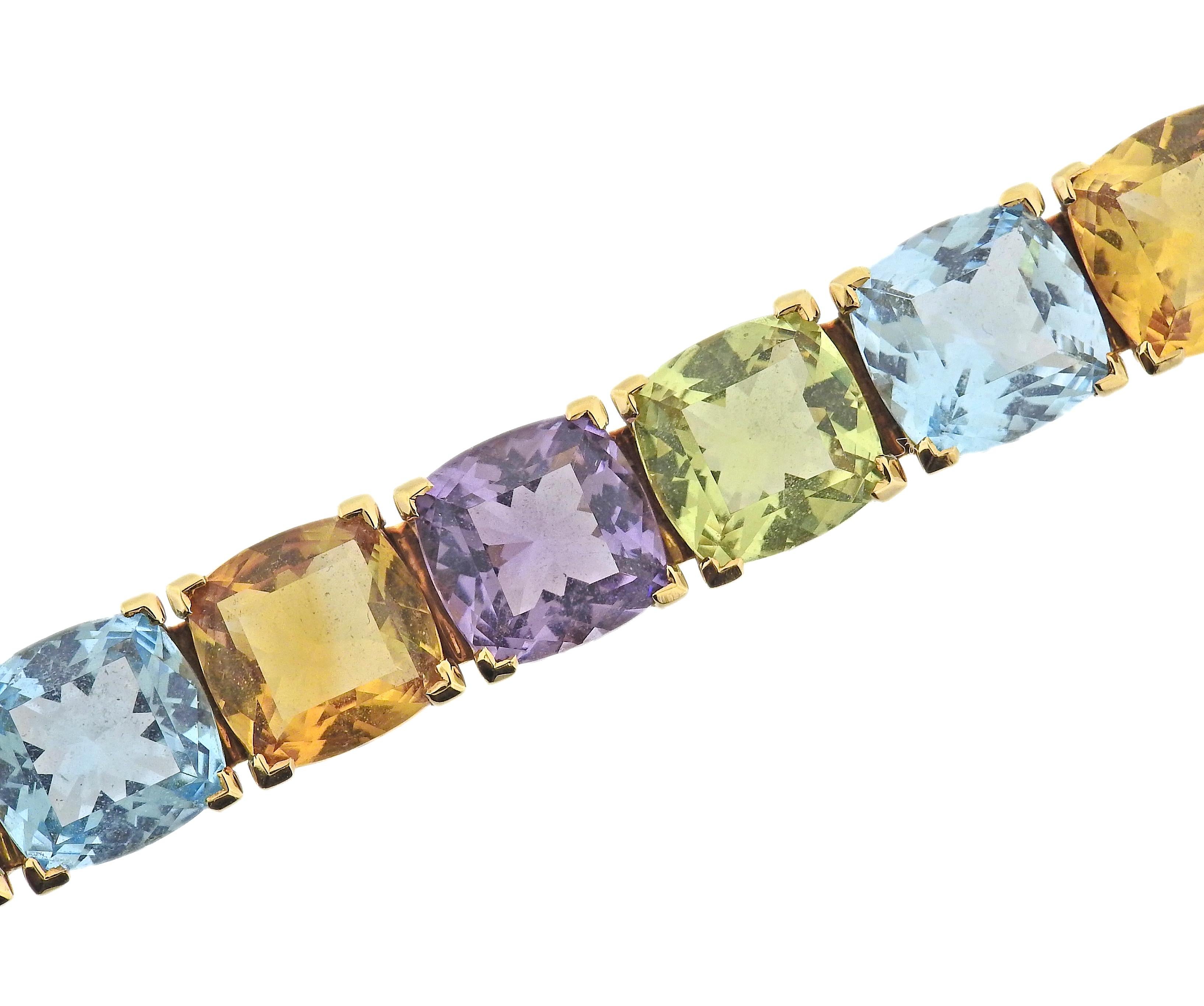 18k gold bracelet by Asprey, featuring topaz, citrine, peridot and amethyst. Come with box.  Bracelet is 7 2/8