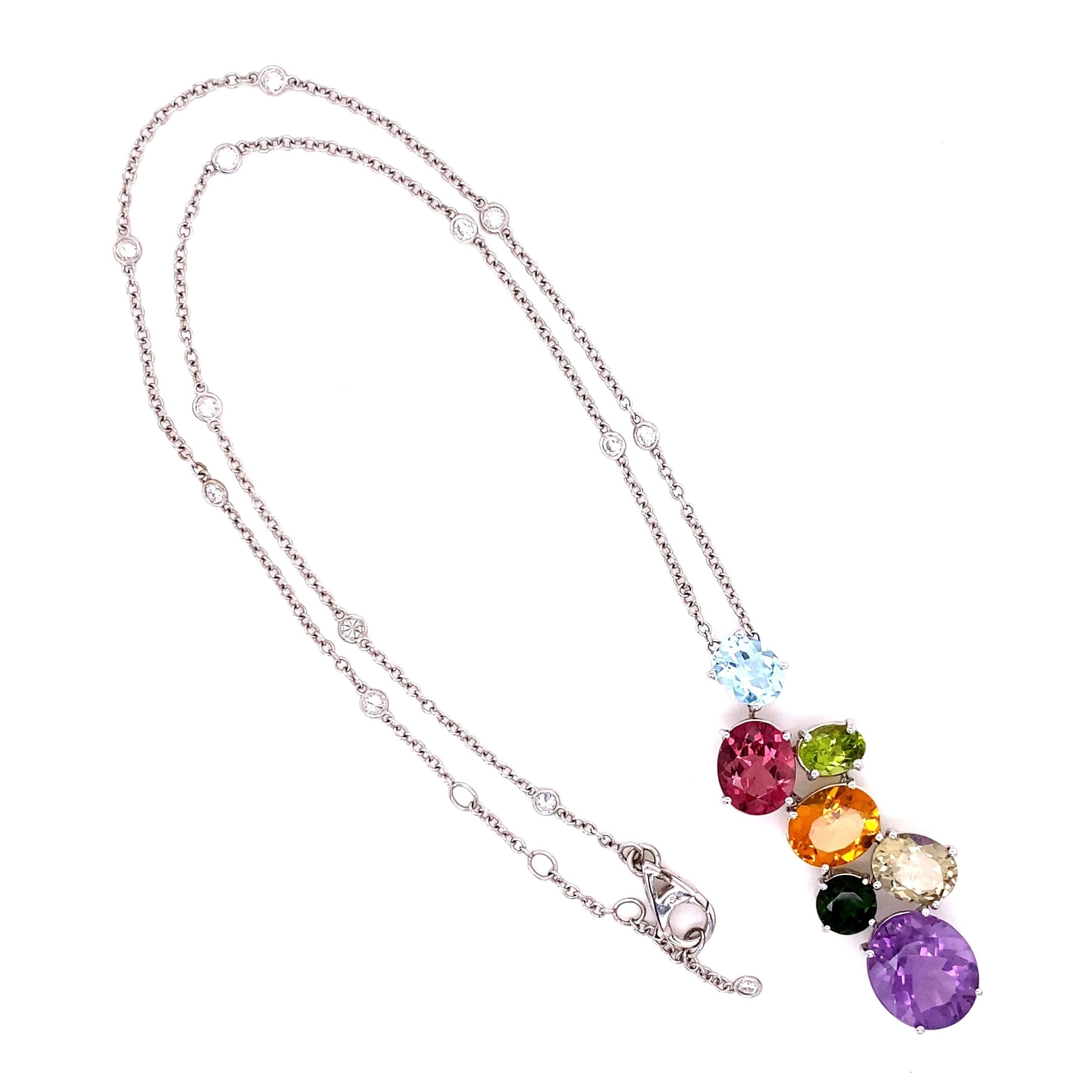 Simply Beautiful! Designed as a linear cluster of Vari-Gemstones, Tourmaline, Peridot, Aquamarine, Citrine, Amethyst and lemon Quartz, suspended from a fine 18K White Gold link Chain enhanced by spectacle-set Diamonds, approx. 1.00tcw. Chain