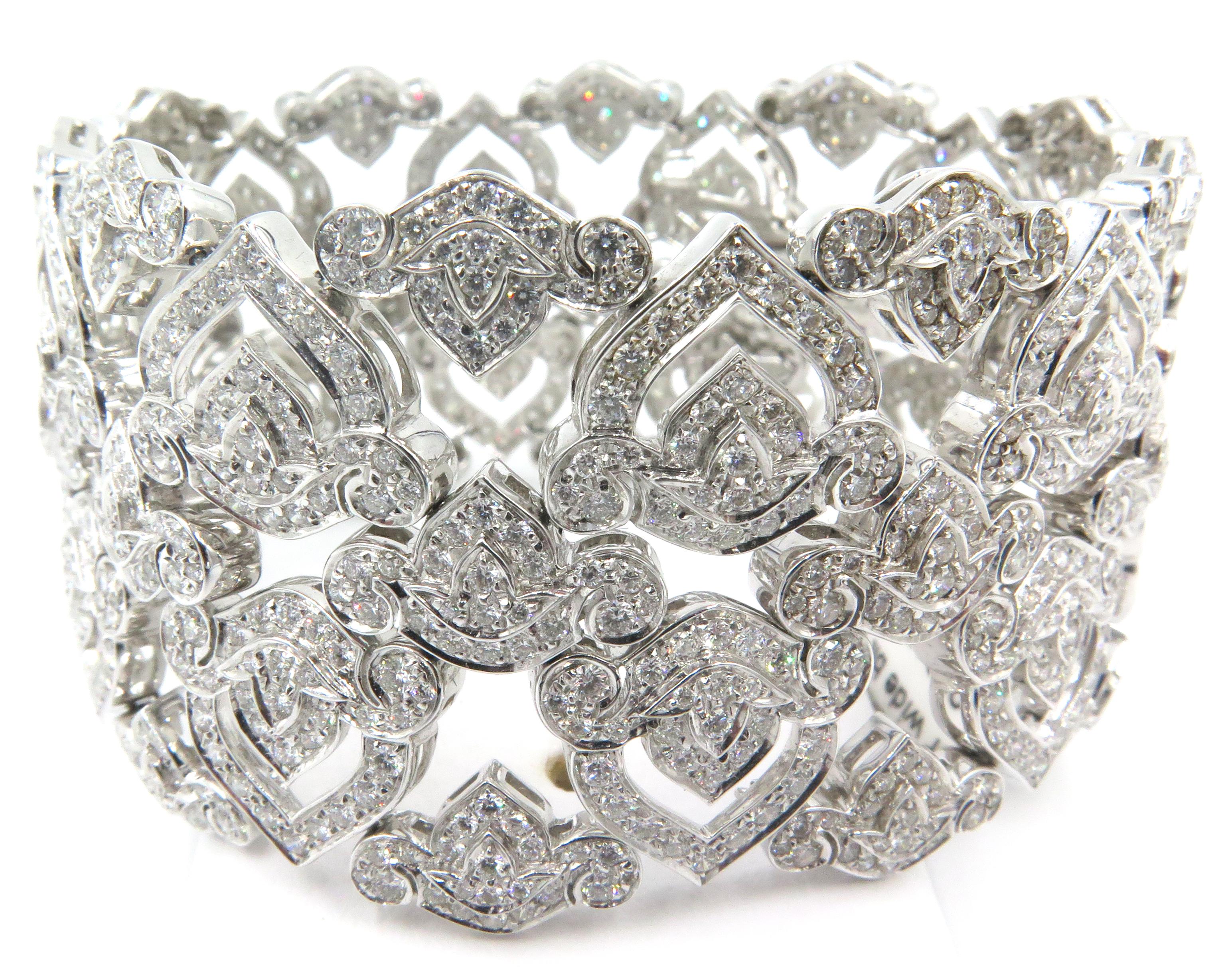 Feminine, lacey ,romantic, and just plain beautiful this bracelet by Asprey of London is crafted in 18k white gold, and set with 13.25cts of fine diamonds. This regal bracelet is fit for a queen and it happens to have been created by a jeweler who