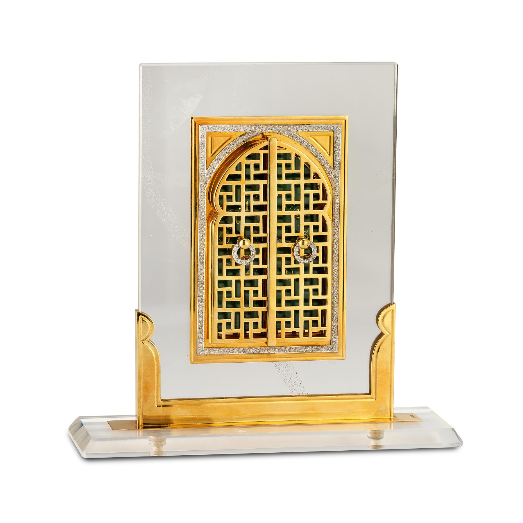 Asprey Rock Crystal, Diamond & Enamel Desk Clock

Description:
A magnificent Asprey Rock Crystal desk clock, exuding the elegance of the Art Deco era. This exceptional timepiece is framed in 18-karat gold and adorned with sparkling diamonds,
