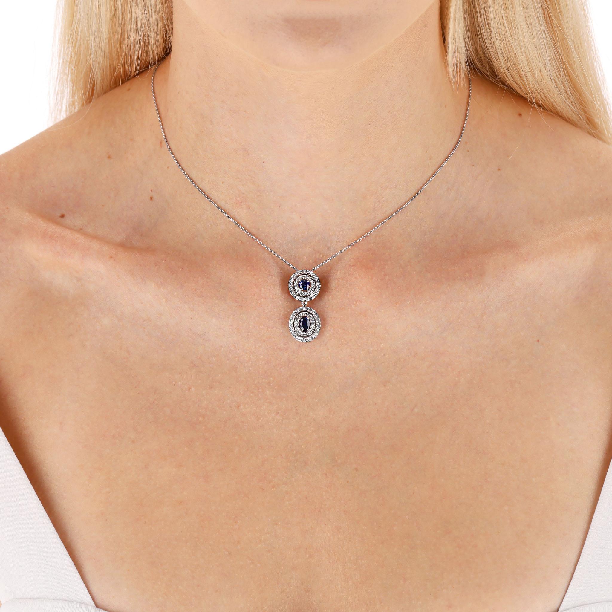 We Adore - Asprey Sapphire & Diamond Pendant Necklace Set In Platinum

Double drop necklace featuring round and oval blue sapphires totalling 1.07ct.

Each stone is encircled by two concentric halos of brilliant-cut eighty-one white diamonds