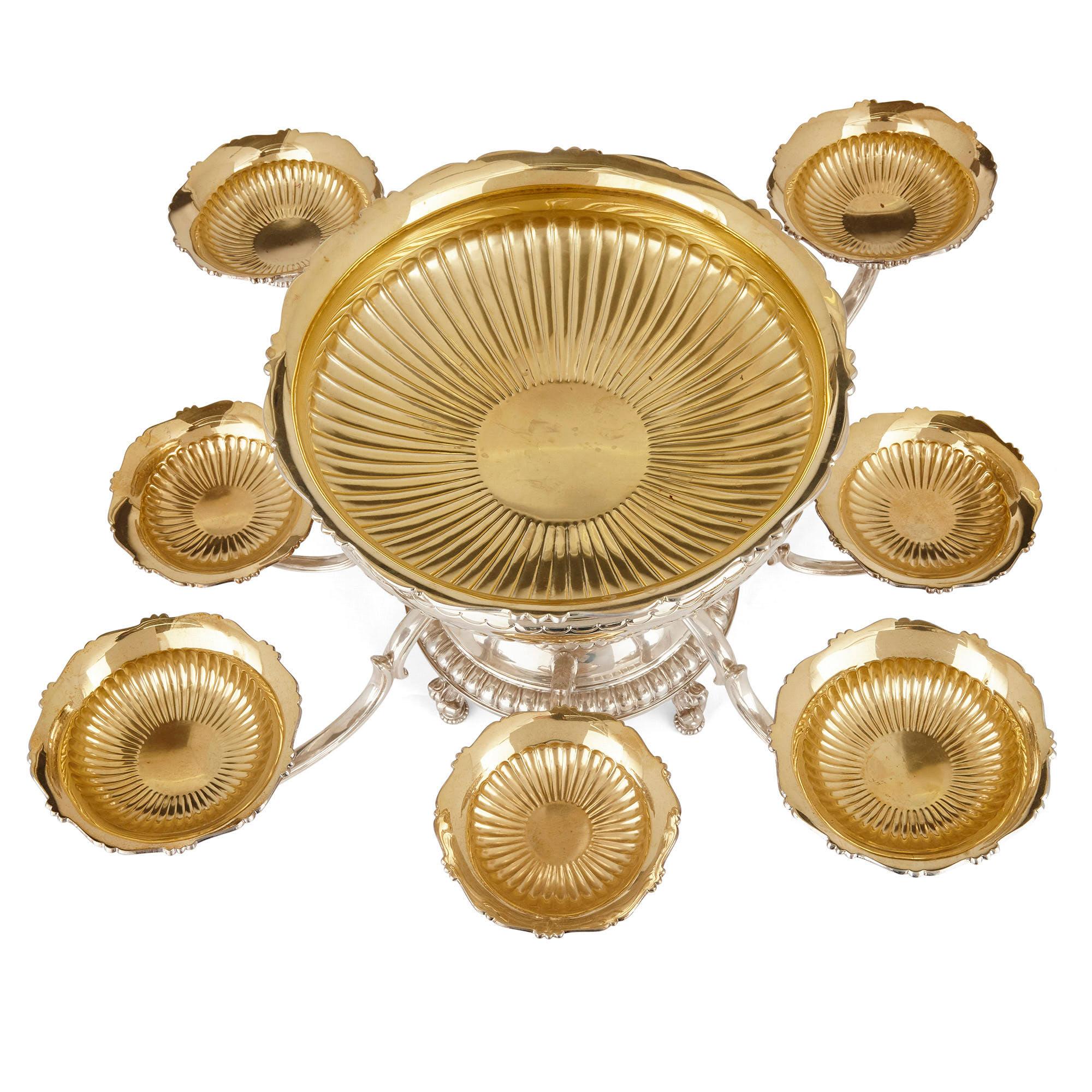 Asprey vermeil and silver table centerpiece
English, late 20th century
Measures: Height 33cm, diameter 80cm

This sterling silver and gilt epergne centerpiece was crafted by luxury makers Asprey, which was founded in late 18th century, London.