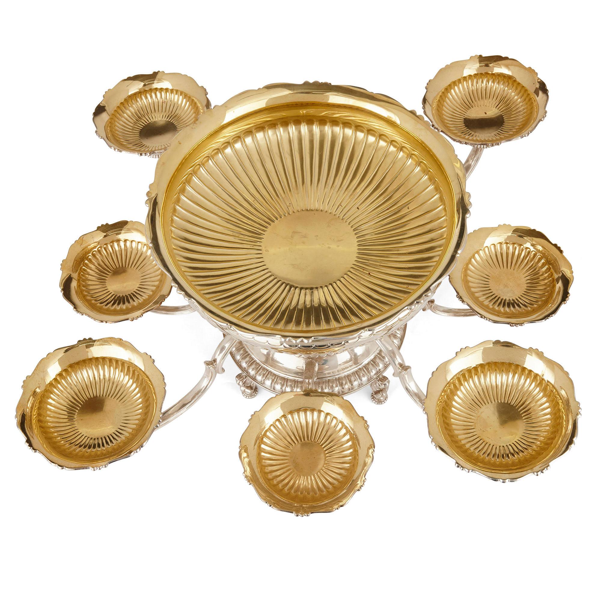 Asprey vermeil and silver table centerpiece
English, late 20th century
Measures: Height 33cm, diameter 80cm

This sterling silver and gilt epergne centerpiece was crafted by luxury makers Asprey, which was founded in late 18th century, London.