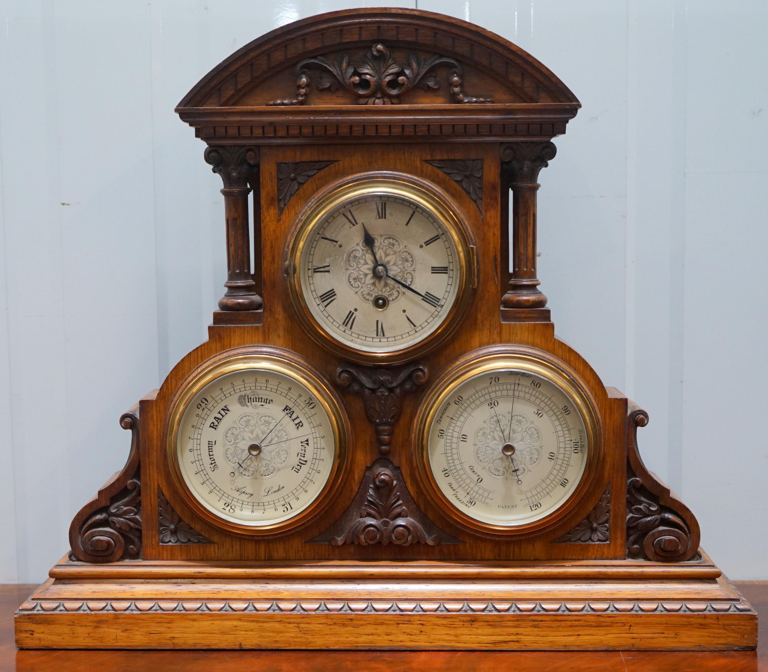 We are delighted to offer for sale this very grand stunning Victorian circa 1880 hand-carved mahogany with Corinthian pillars combination clock, barometer and thermometer designed by and retailed through Asprey London.

A very rare piece in