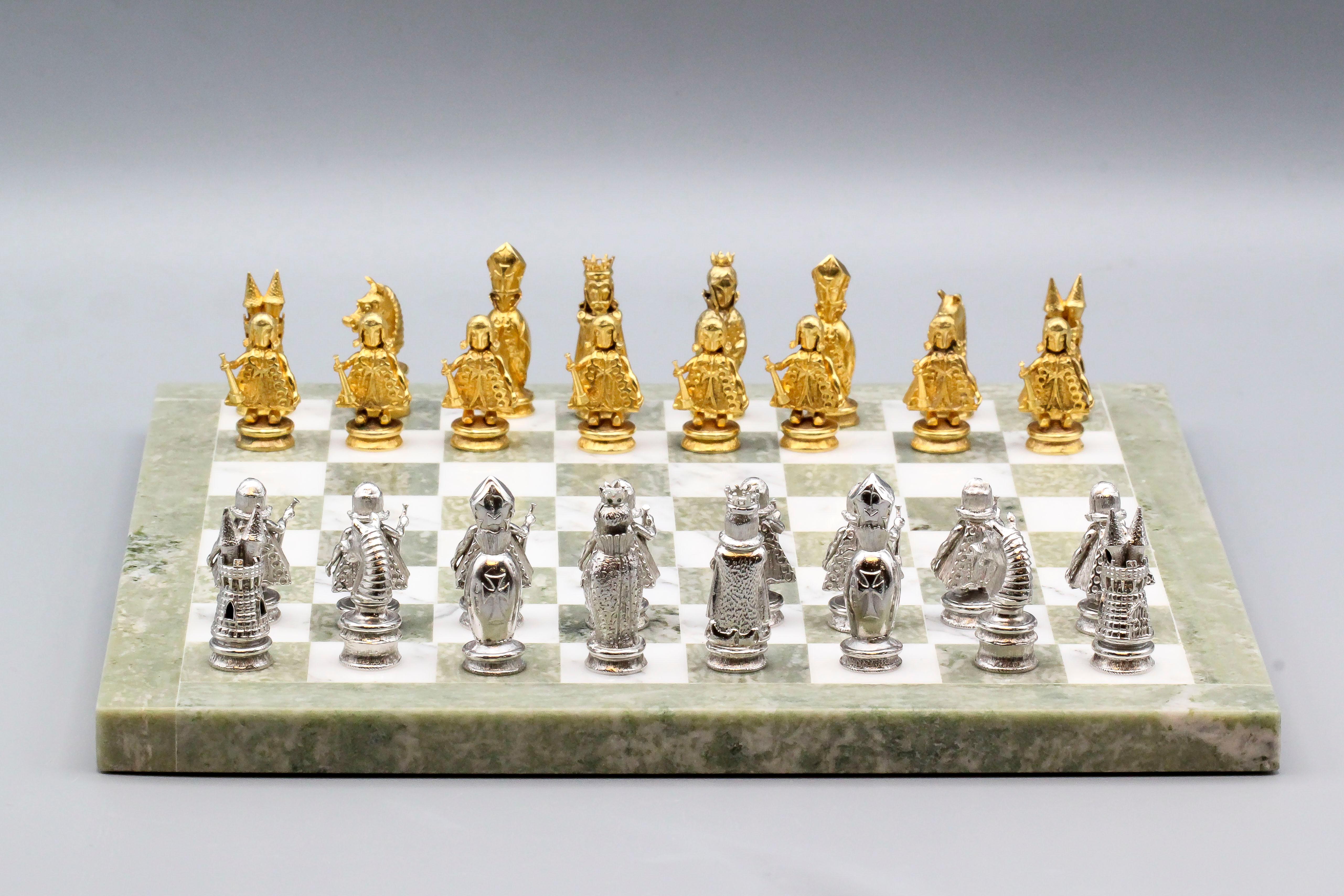 Very fine and rare chess set by Asprey, circa 1960s.  The set features 32 9k yellow and white gold pieces with a marble board.  Comes with its own carrying case. 

Hallmarks: A.C.Co. 9 375, British assay marks
