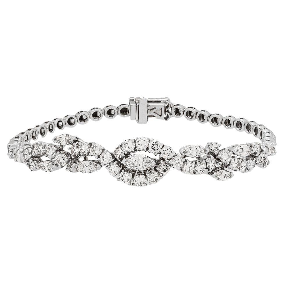 A scintillating 18k white gold diamond bracelet by Asprey. The bracelet is set to the centre with a marquise cut diamond with an approximate weight of 0.38ct, E-F colour and VS clarity. The centre diamond is further complemented by 42 round