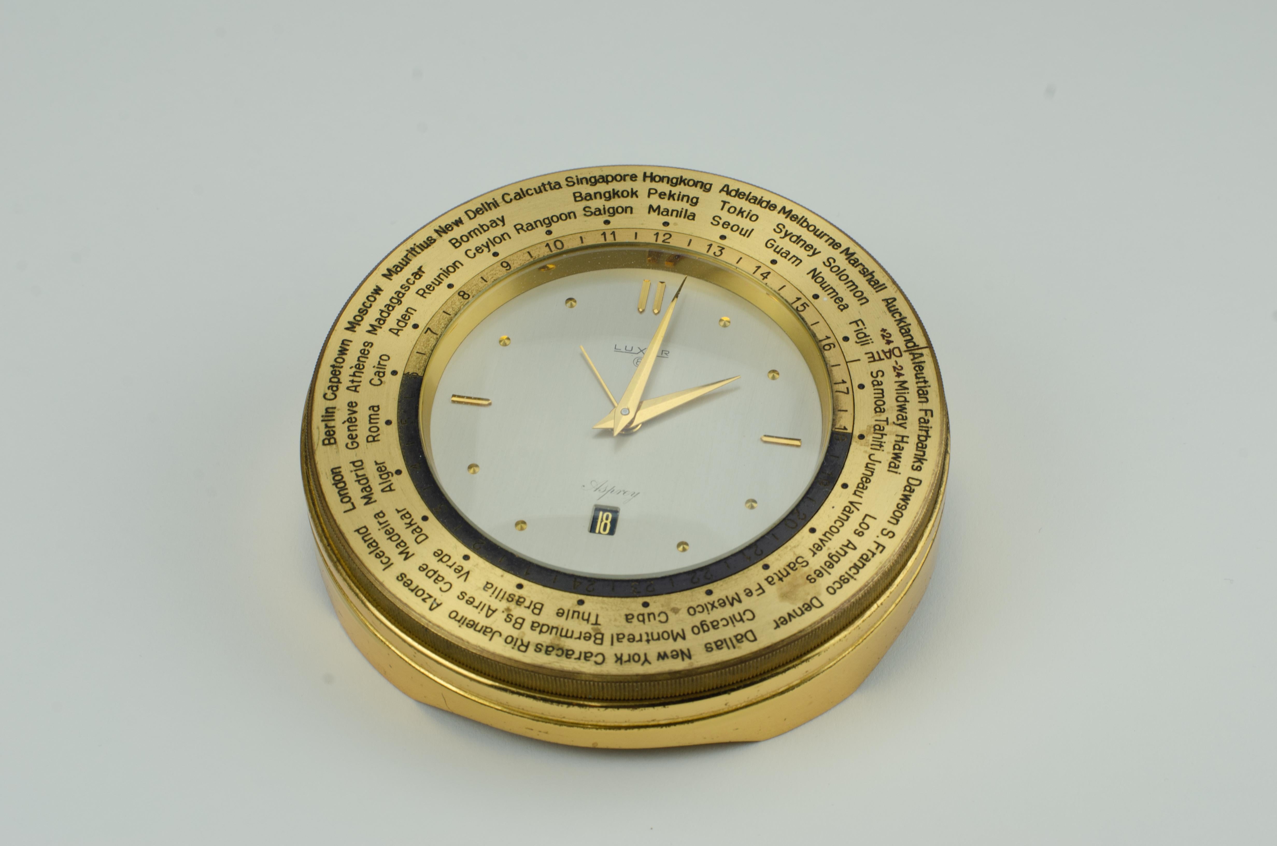 A Classic refined desk clock by Asprey. Featuring a rotating bezel to see what time it is elsewhere in the world.
     