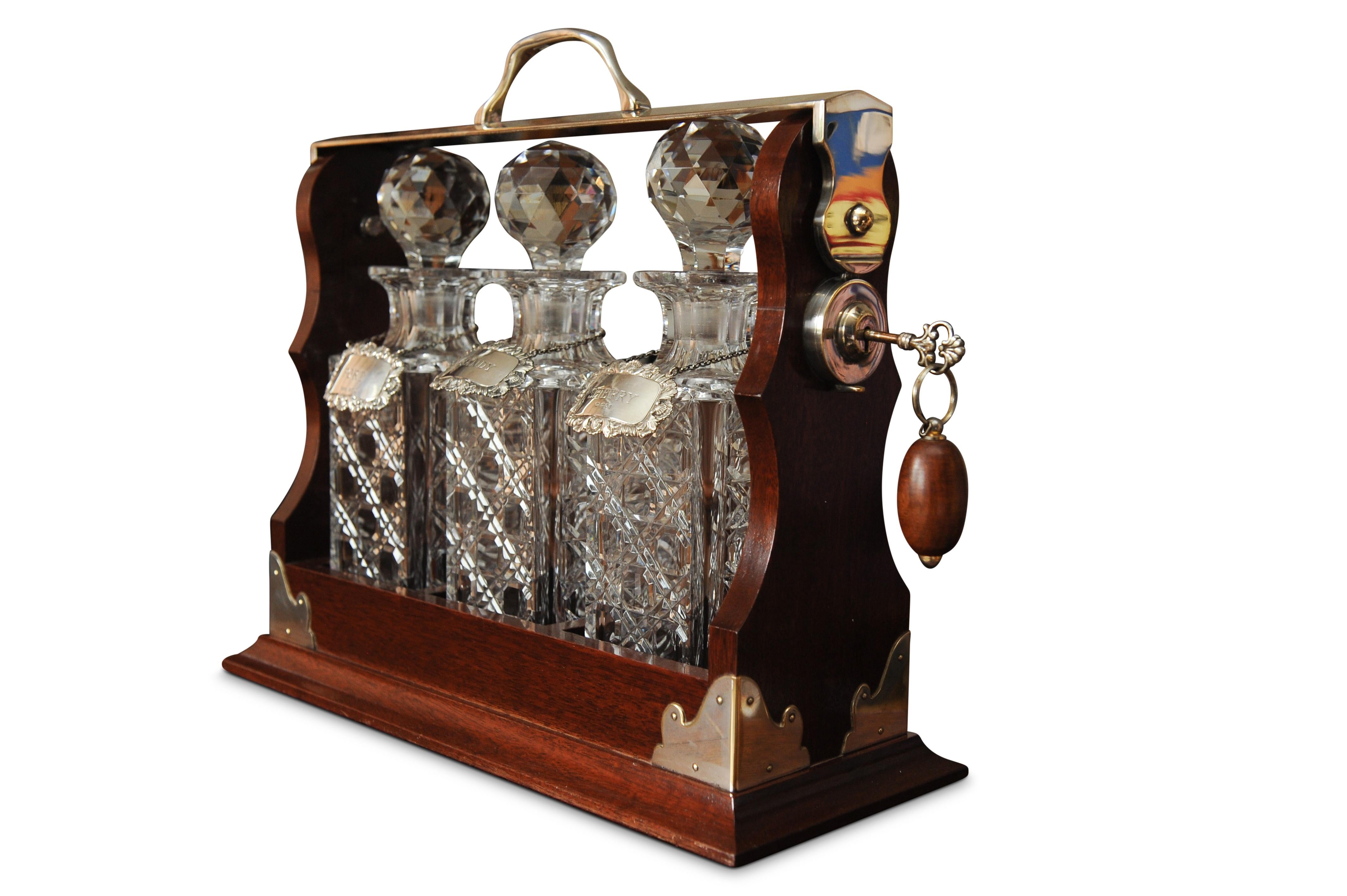 A Stunning Set of Asprey's of London Cut Glass Decanters, with Matching Sterling Silver Collars, Enclosed Within A Mahogany and Silver Plate Tantalus. Circa 1920's. Labelled Asprey's London on the side.

Cut Glass Decanters in great condition for