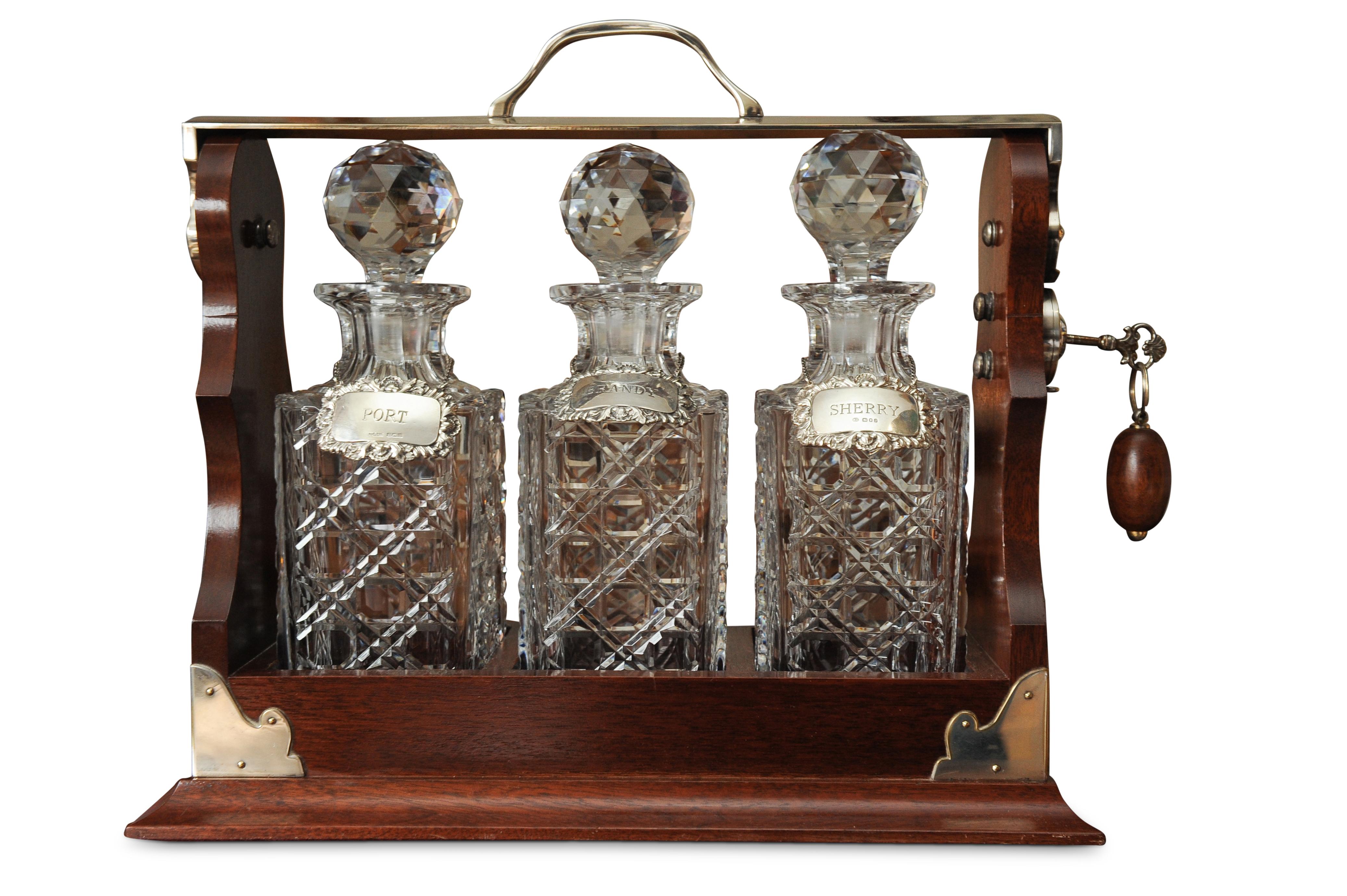 Asprey's 1920's Tantalus Cut Glass Decanter Set With Matching Silver Collars In Good Condition In Reading, Berkshire