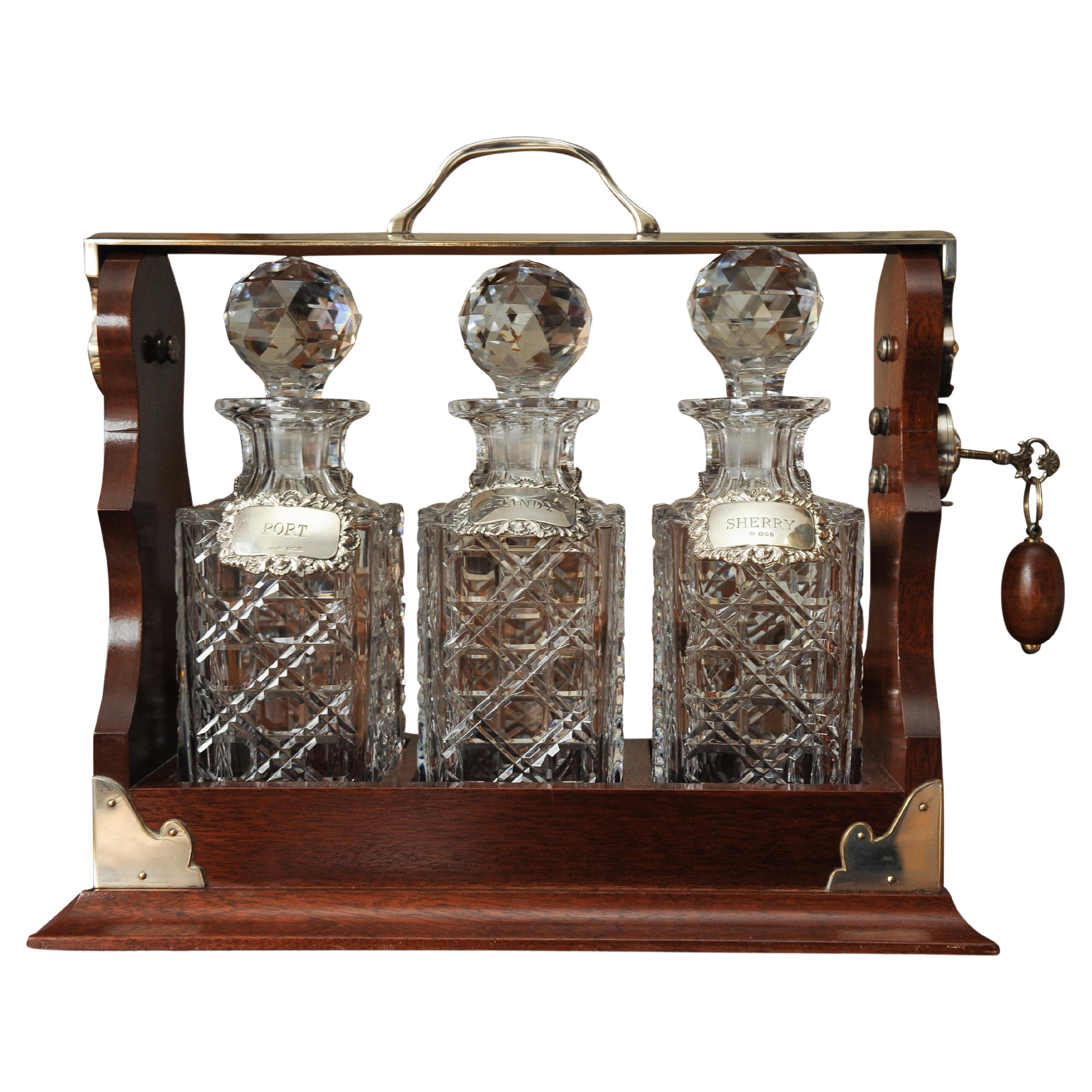 Asprey's 1920's Tantalus Cut Glass Decanter Set With Matching Silver Collars